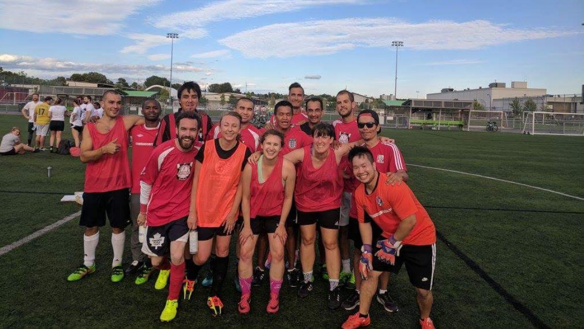 Soccer Team smiling in red uniforms