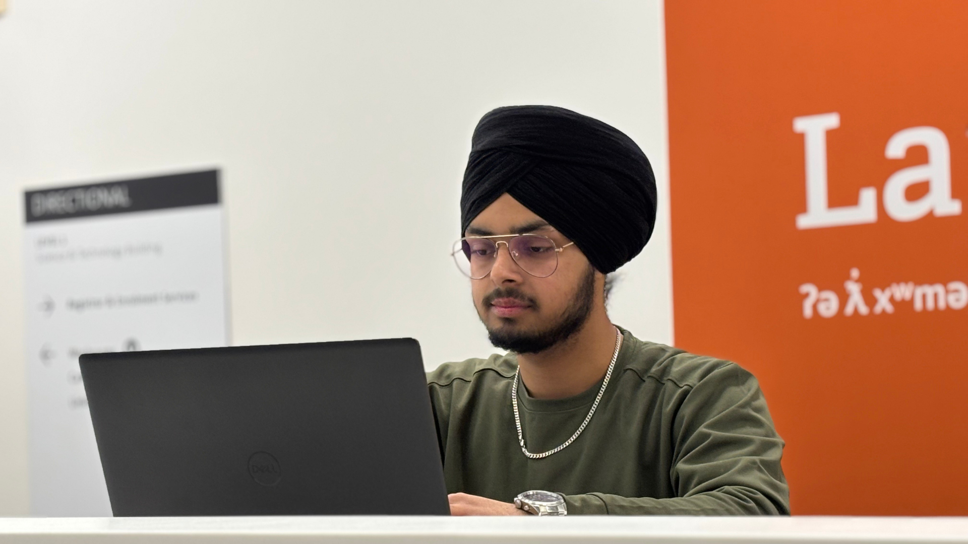 Langara student on his computer