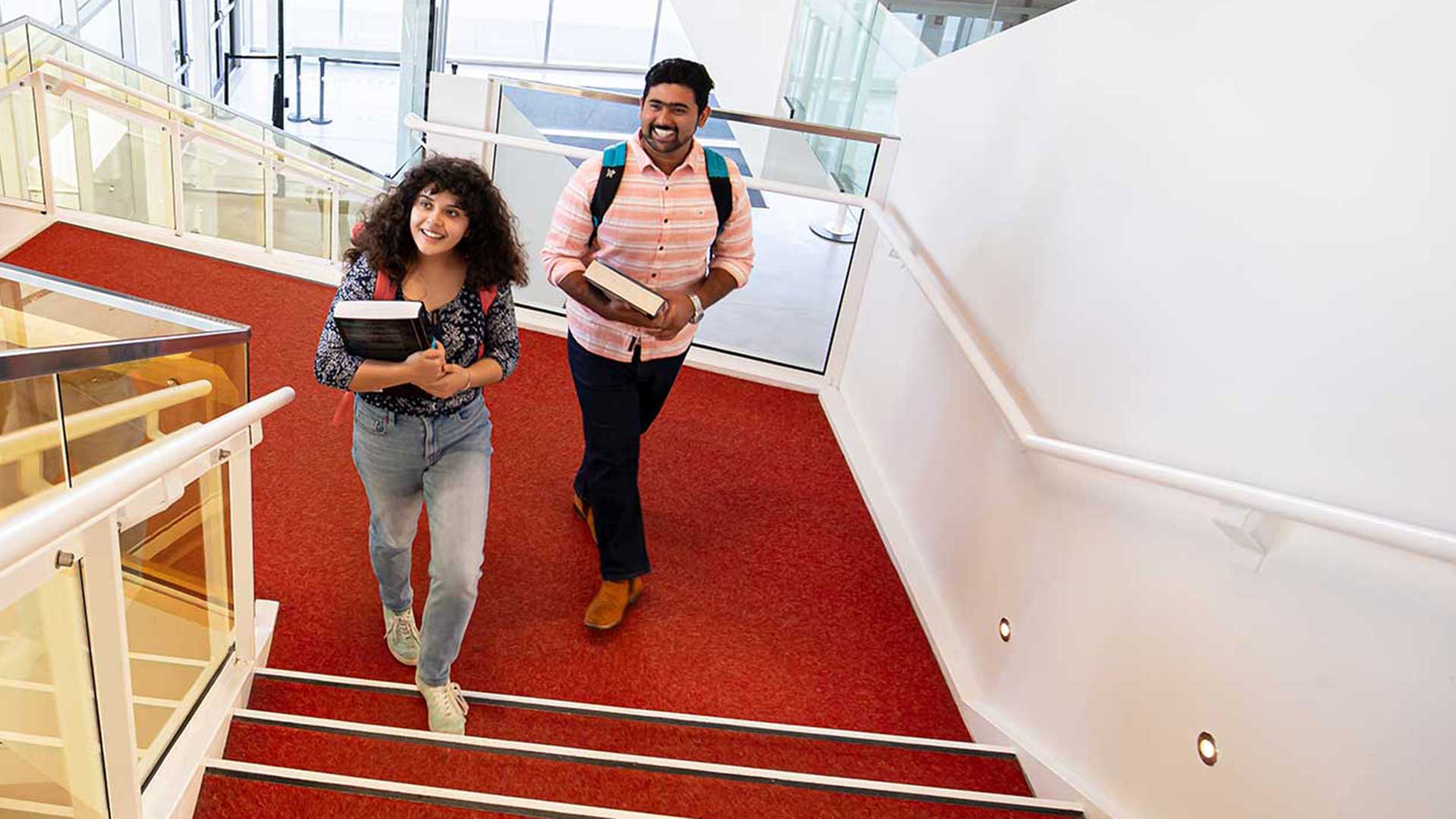 Student stroll up the stairs with a spring in their step, savoring the sweet freedom that comes after their final class of the day.