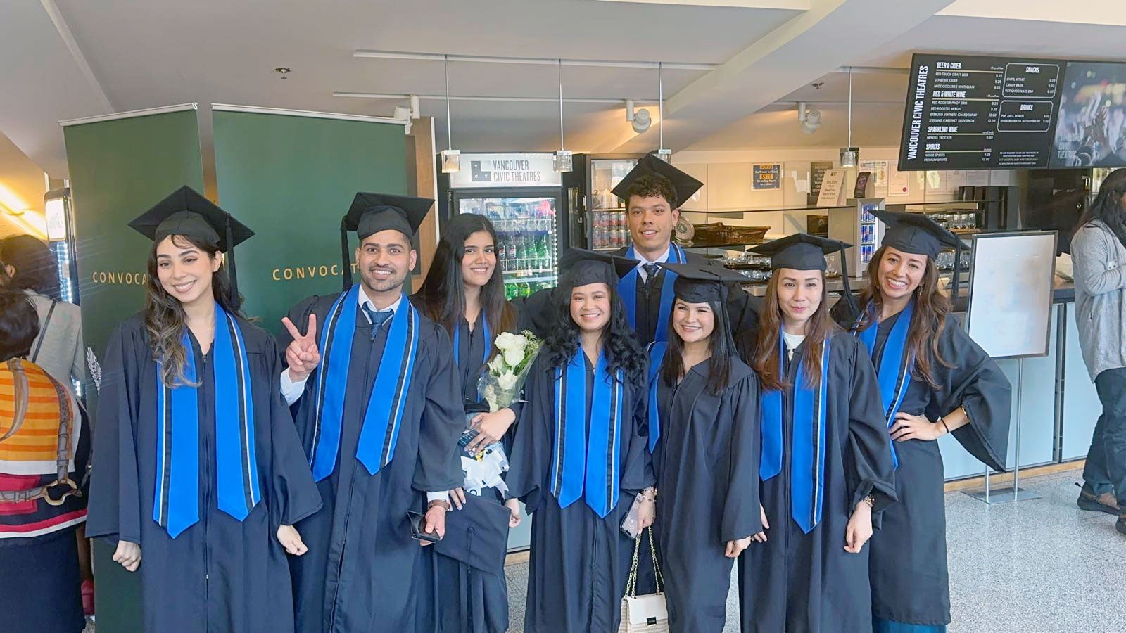 Andres Viloria Garcia at Convocation posing with some of his classmates