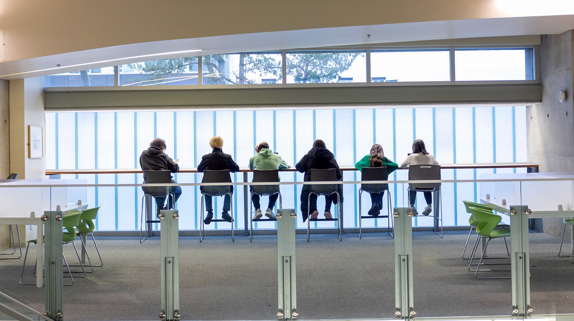 Students at the library studying 