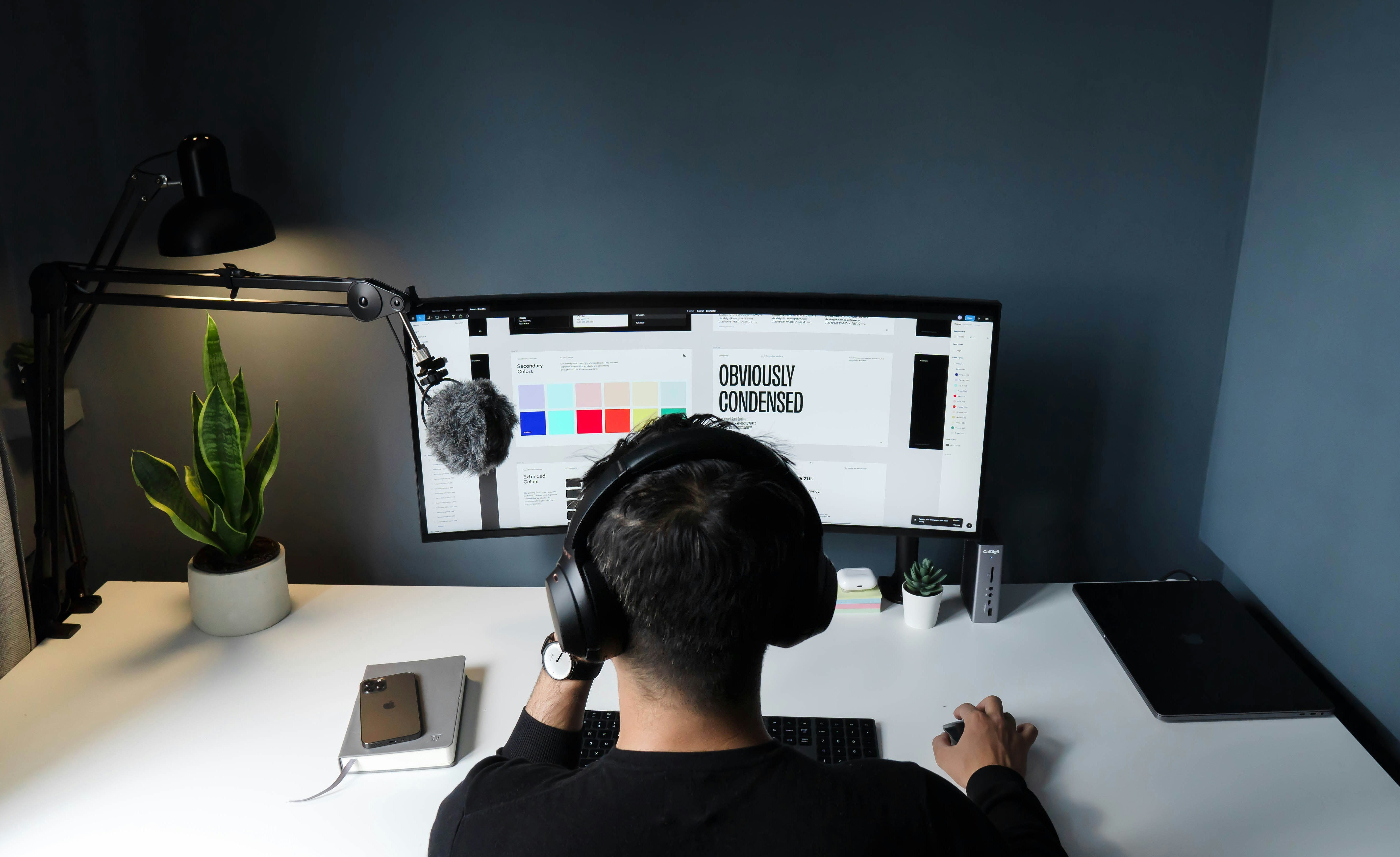 A designer working on a computer.