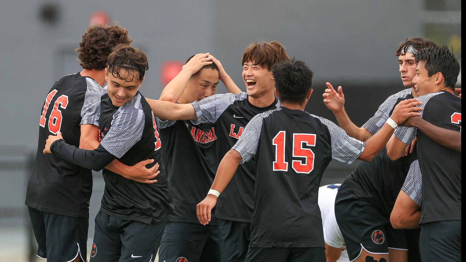 Falcons men's soccer team celebrating