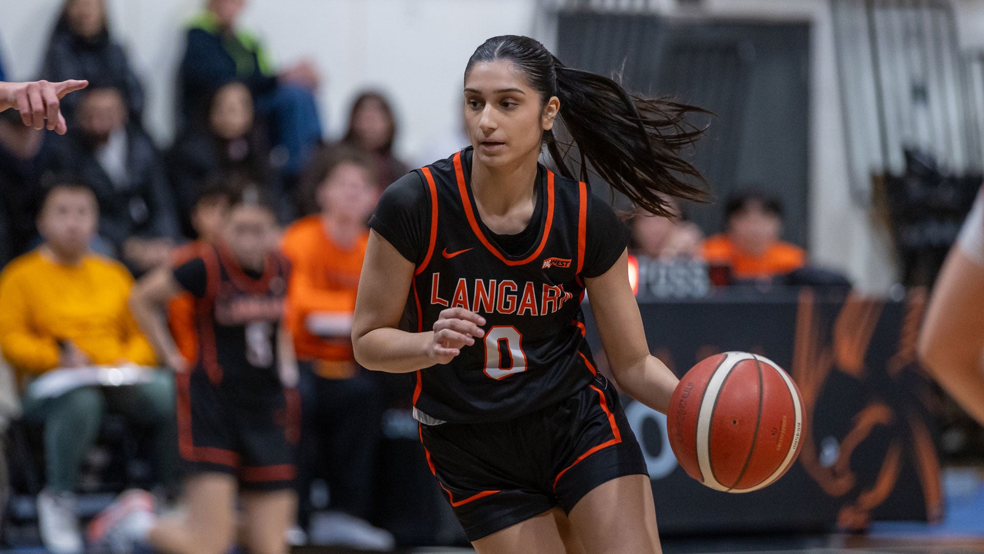 Falcons women's basketball player on court