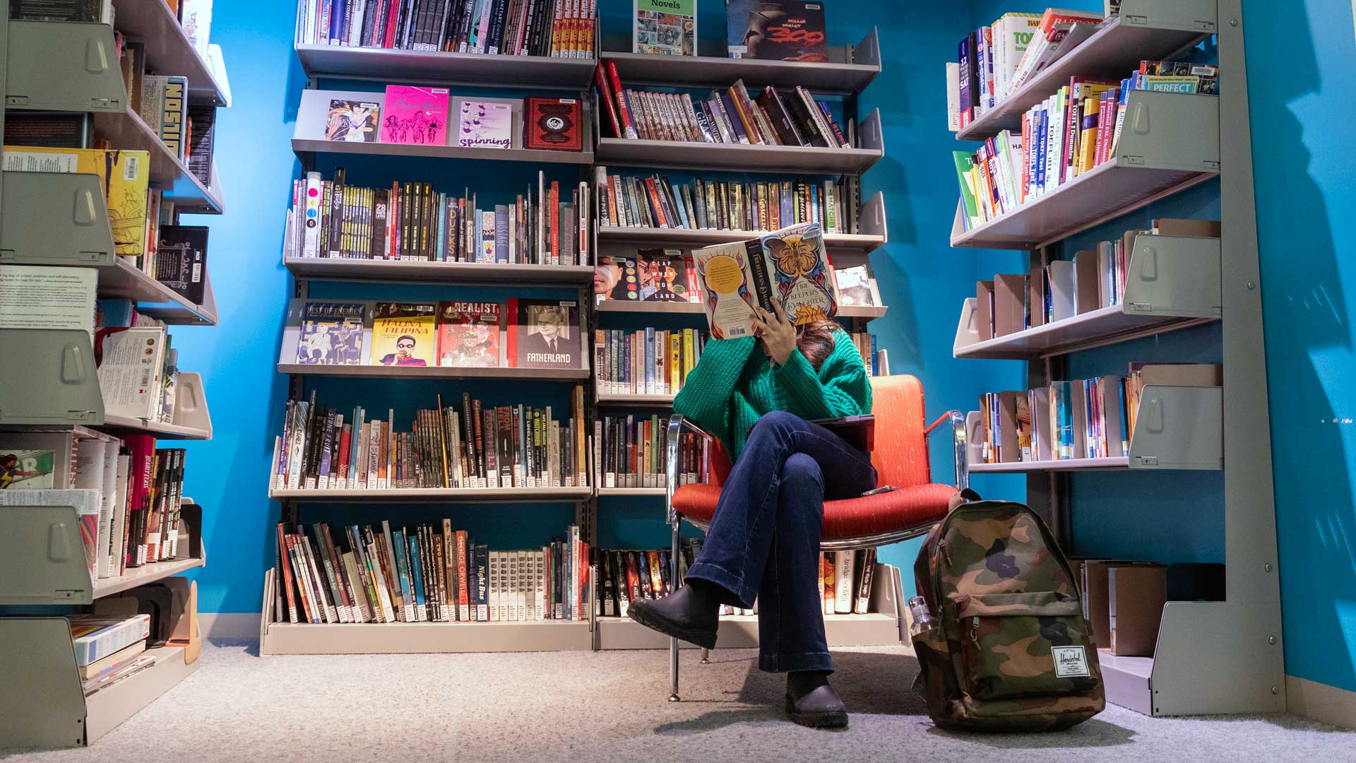 Student at the library reading 