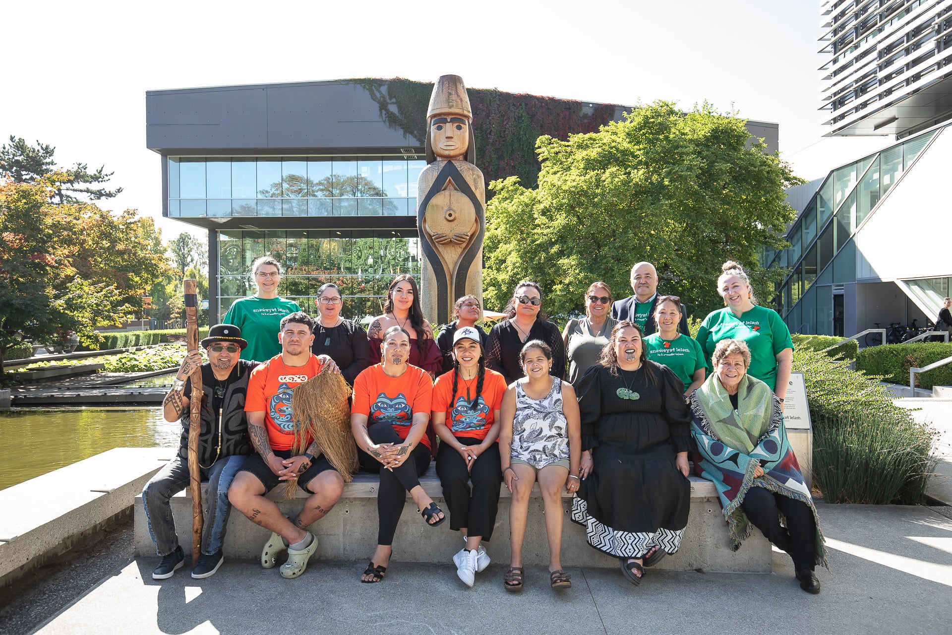 Members of Langara College's Indigenous Engagement and Initiatives team with Maori guests at the College's House Post, gifted by Musqueam.
