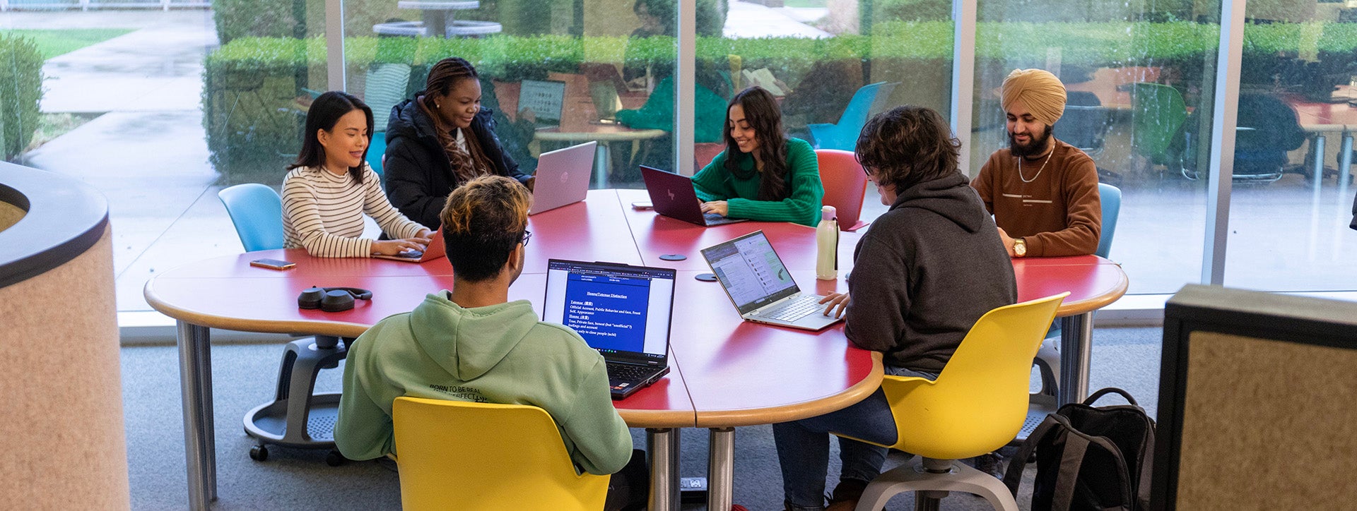 Students at a table in the library