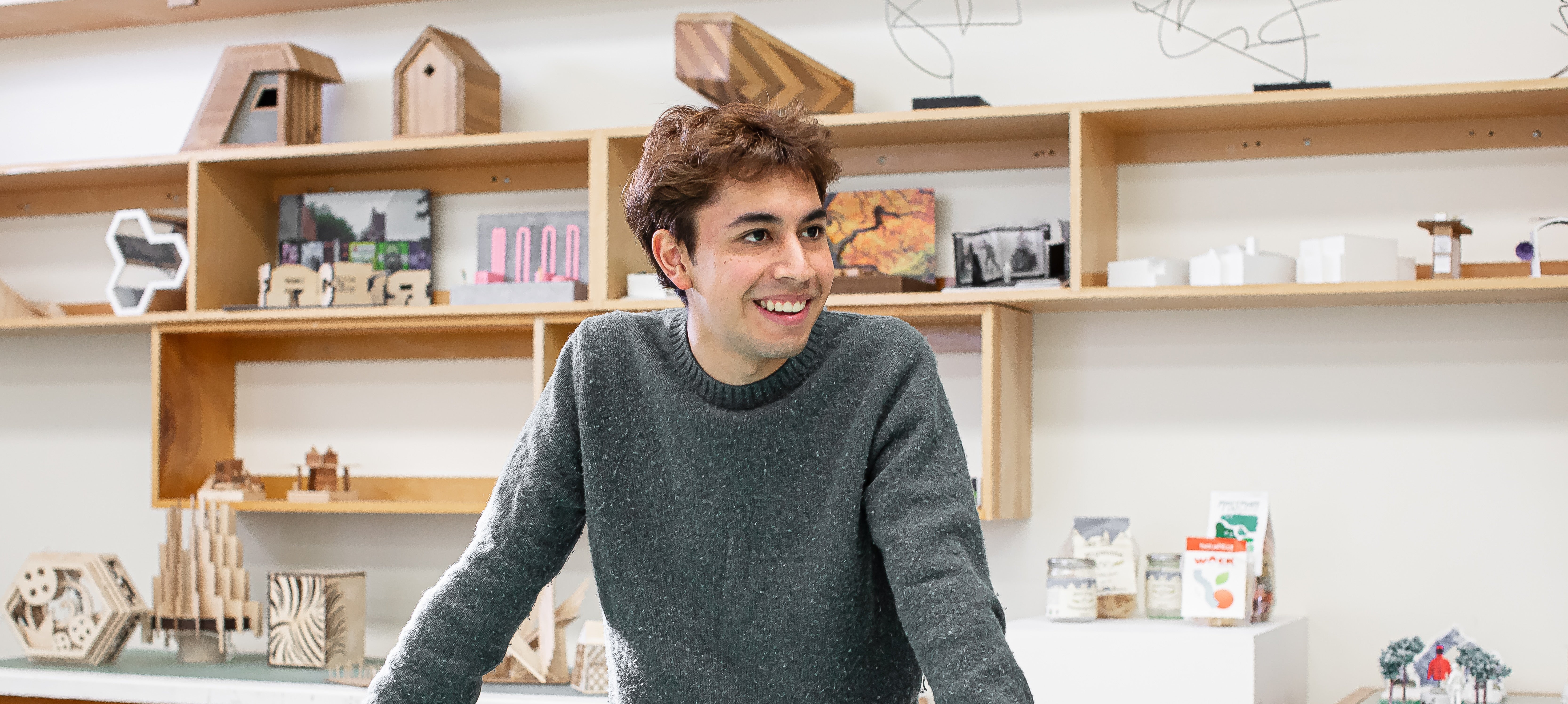Jorge Rebollo Sandoval standing and smiling in Langara's Design Formation studio.