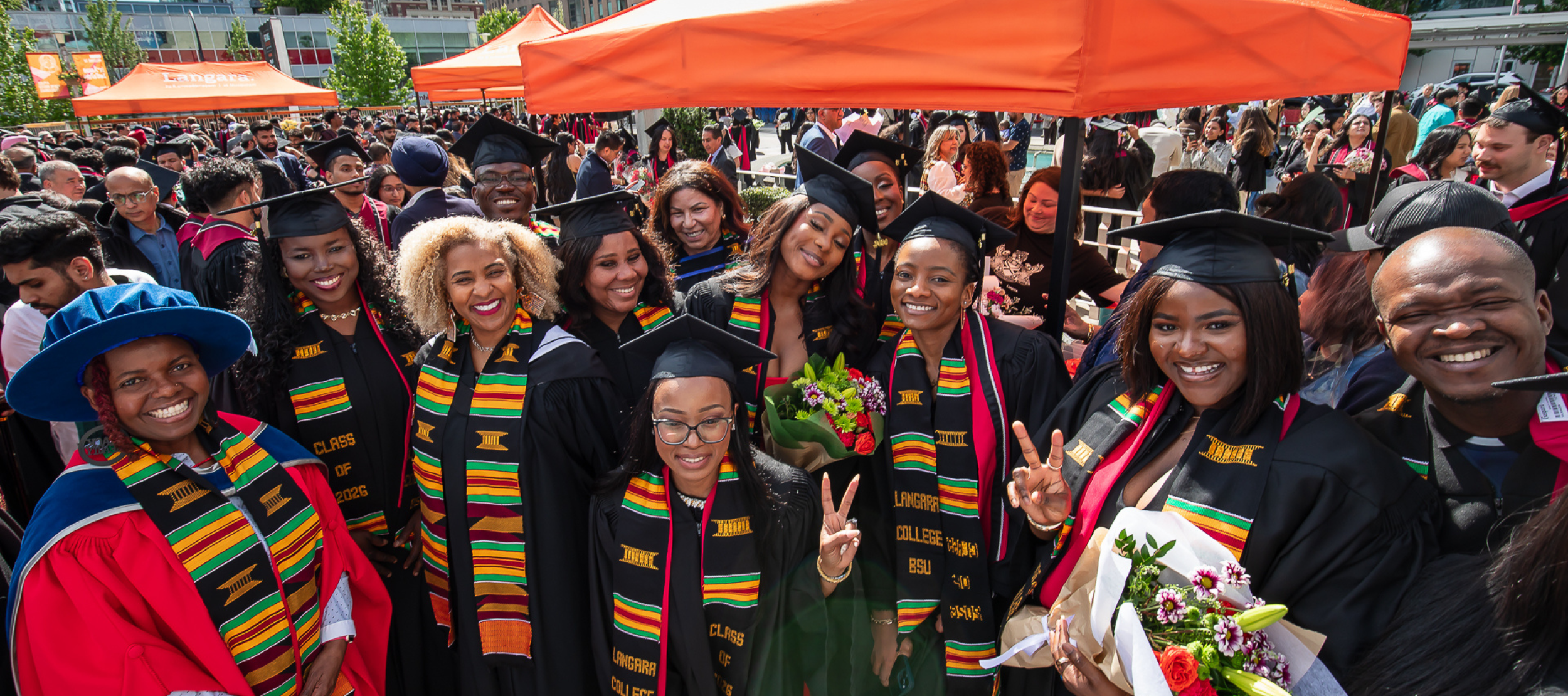 Langara Black Student Union (LBSU) graduates wearing Kente stoles at 2026 Convocation.