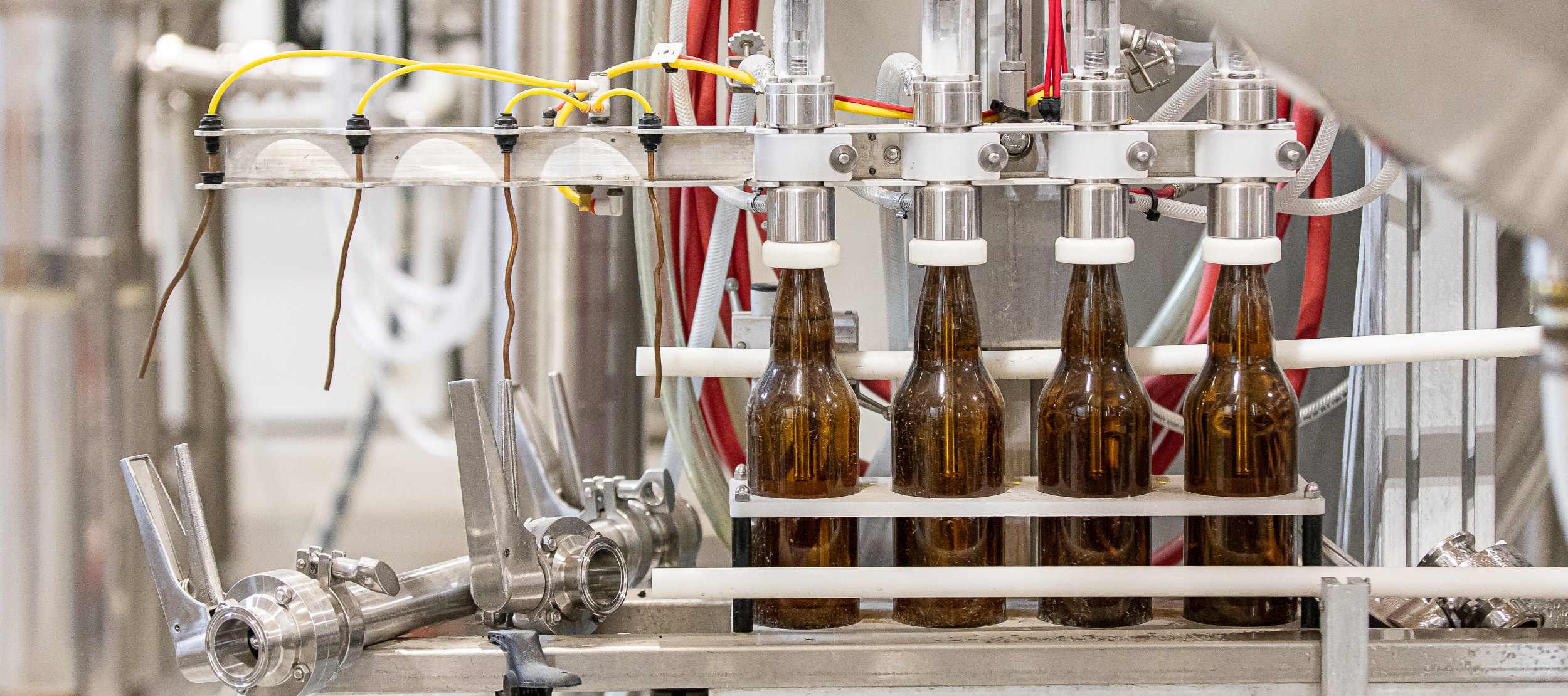 Brown beer bottles being filled on a production line at Barnside Brewing in Ladner, B.C.