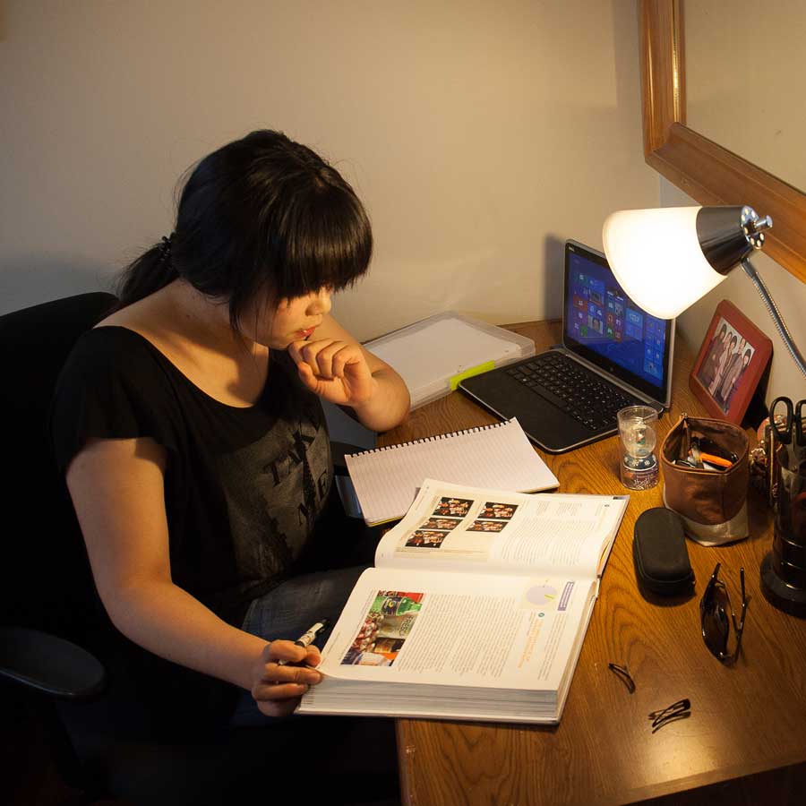 International student in a homestay bedroom.