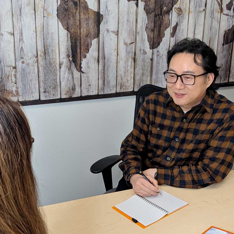 Langara Homestay team member talking with a student