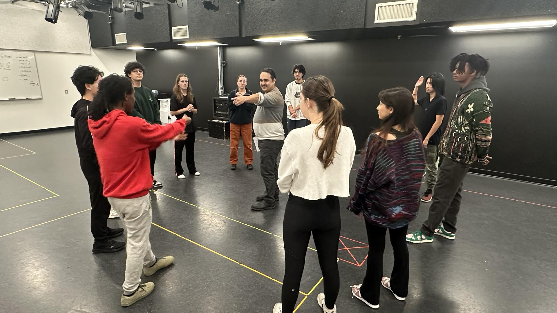 Raes Calvert teaches a group of students.