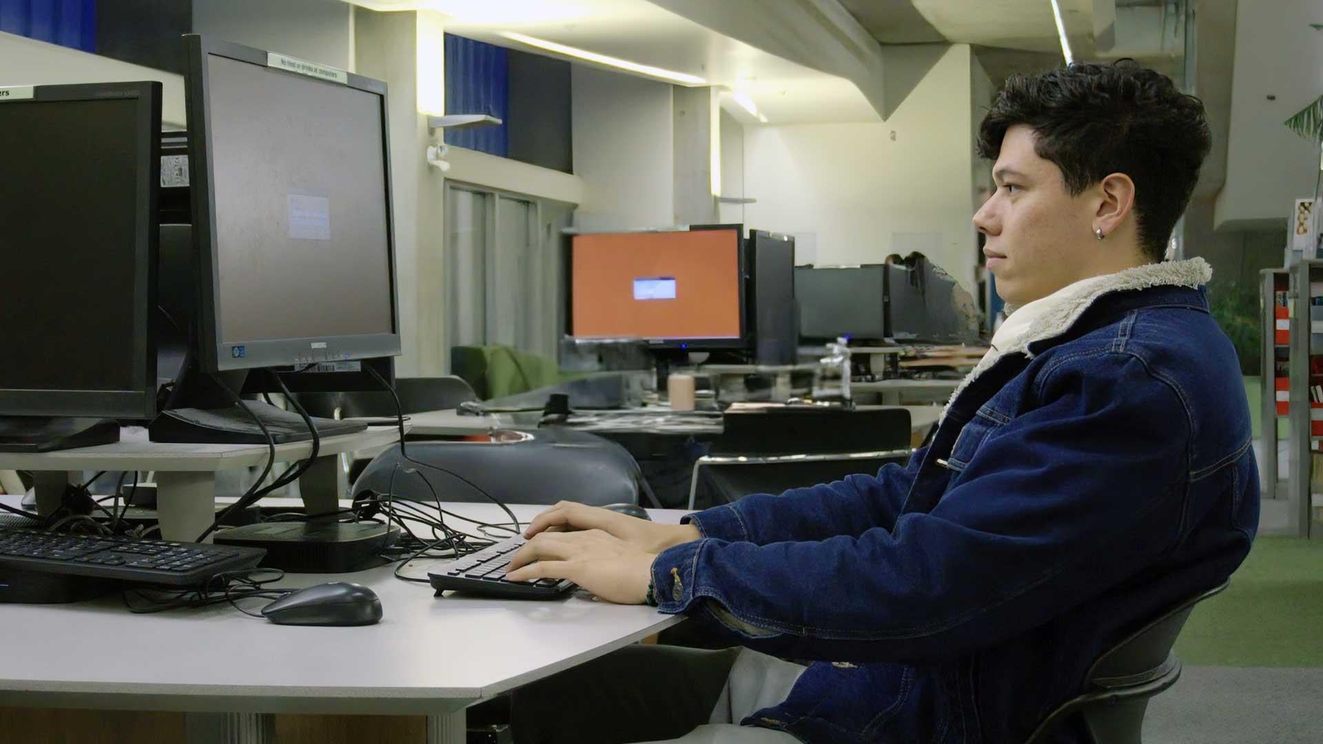 Andres Viloria Garcia at the library doing some homework