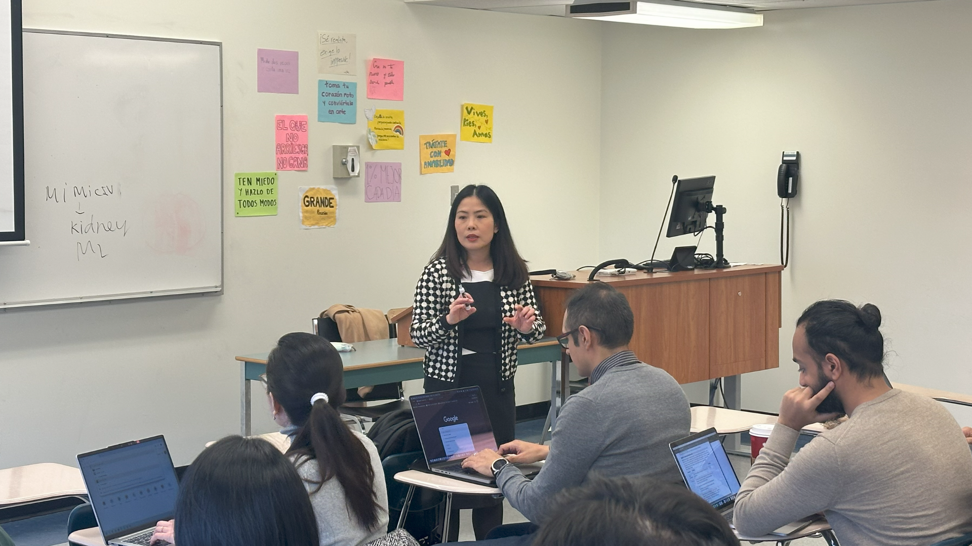 Instructor Monica Nguyen in front of her class