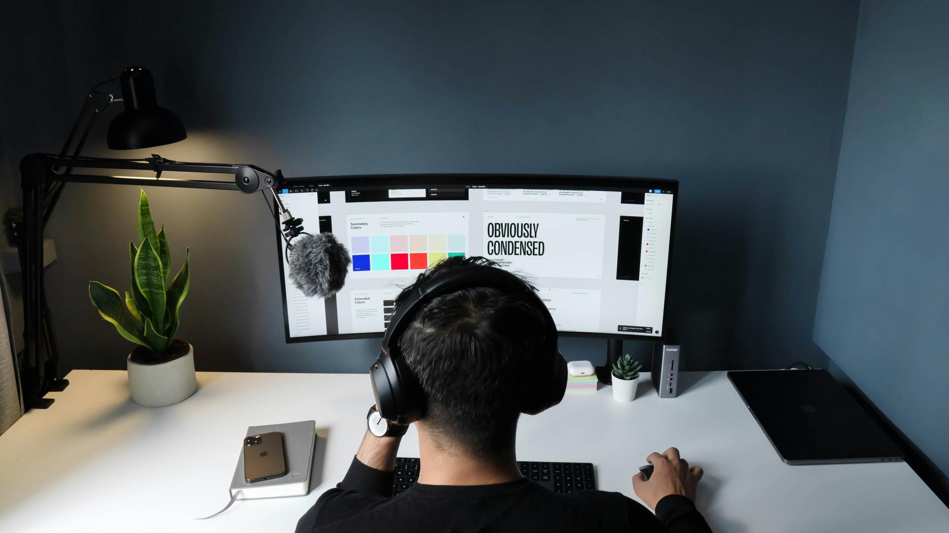 A designer working on a computer.