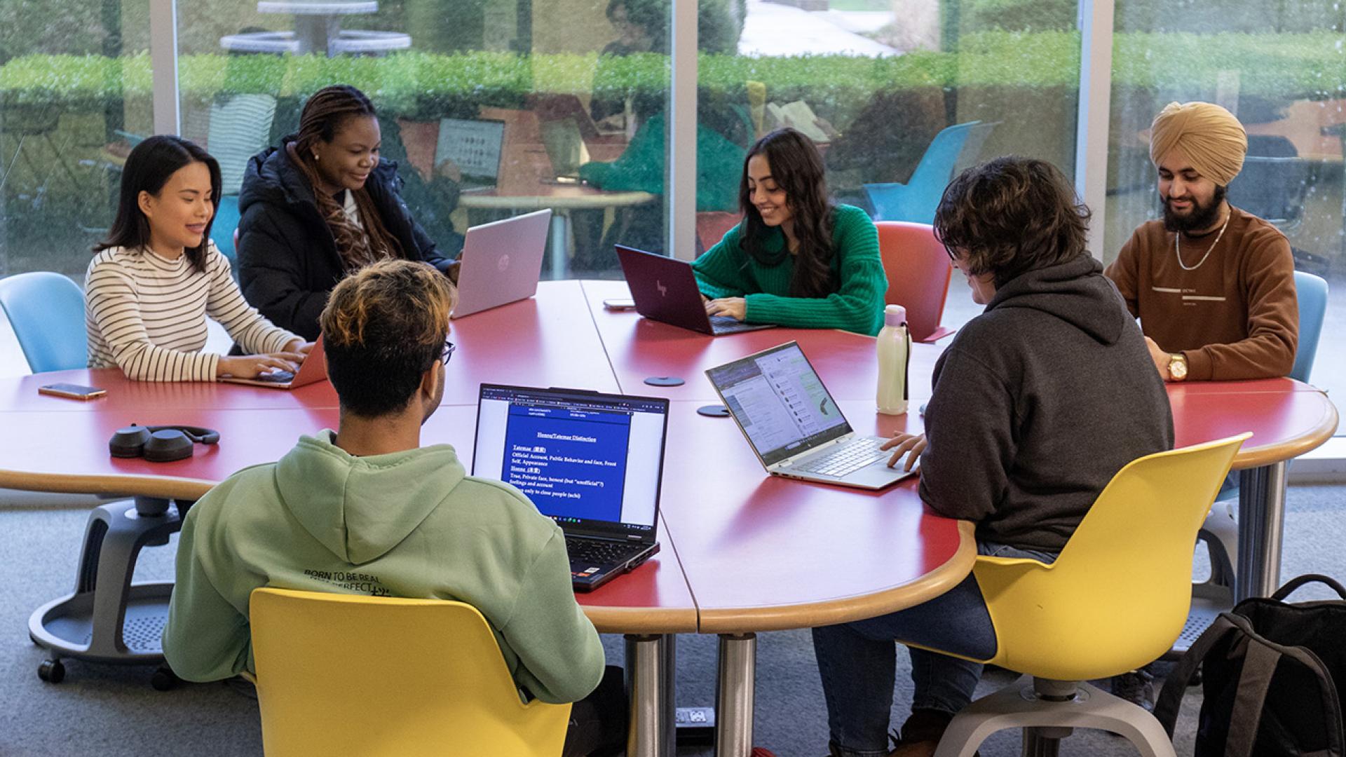 Students at a table in the library