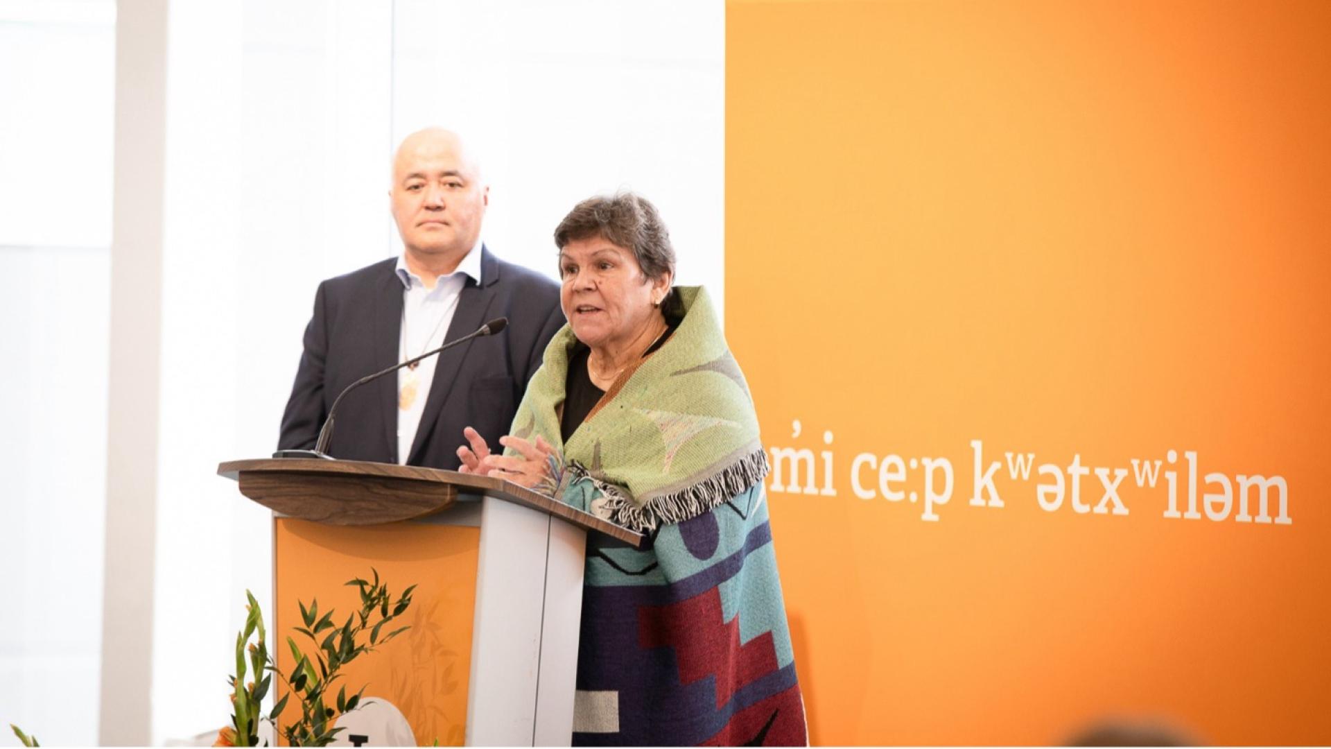 Musqueam Elder Gail Sparrow speaks to an audience.