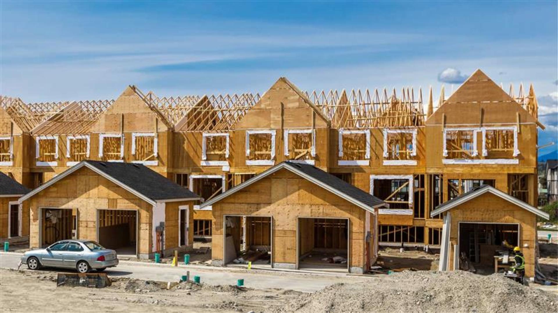 Housing developments in mid-build. Wooden framework is visible.