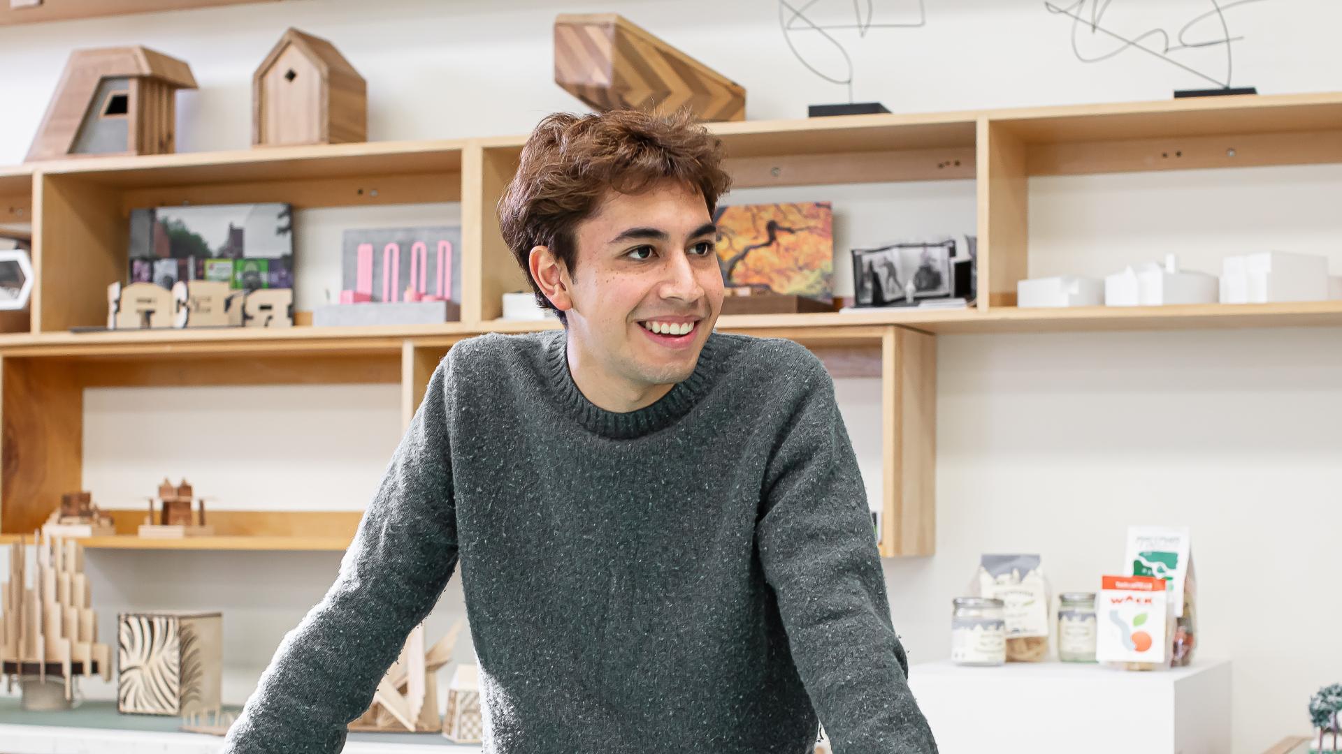 Jorge Rebollo Sandoval standing and smiling in Langara's Design Formation studio.