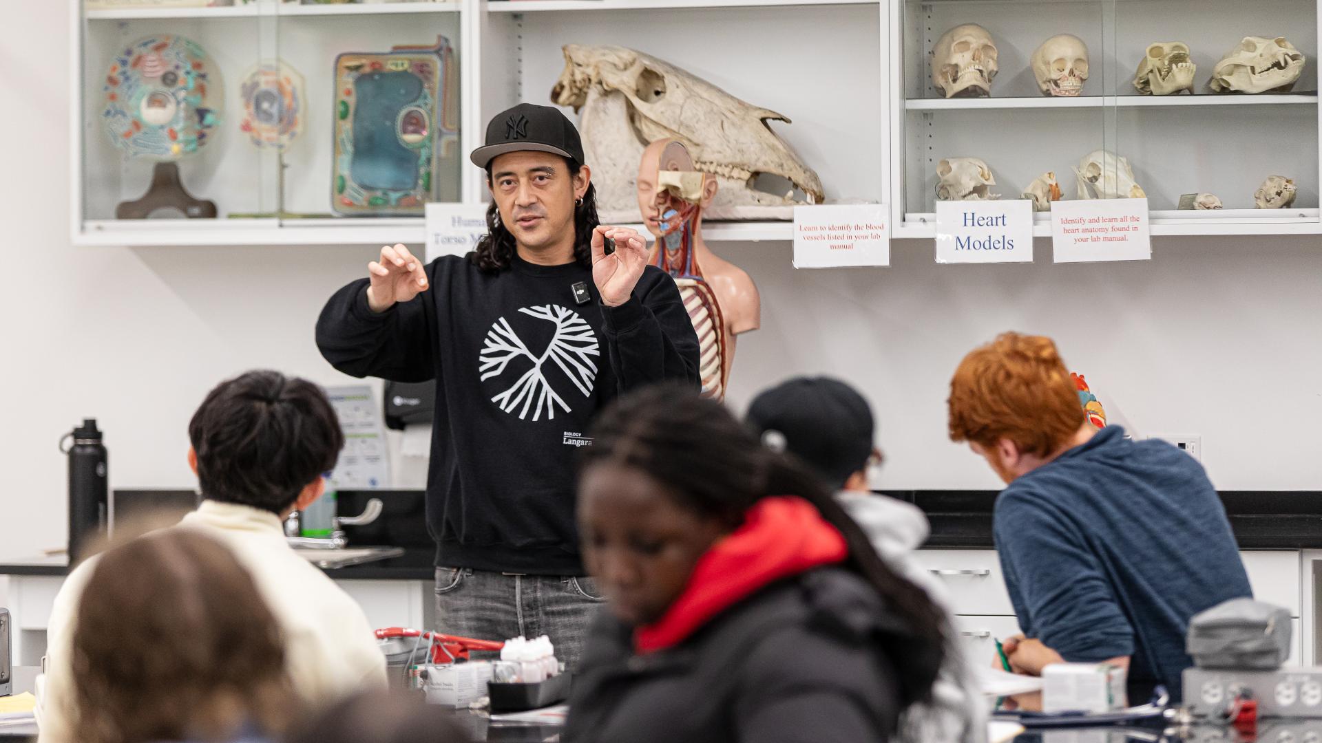 Biology lab demonstrator, Geoffrey Nemeth, reviews the day's work with students in T441.