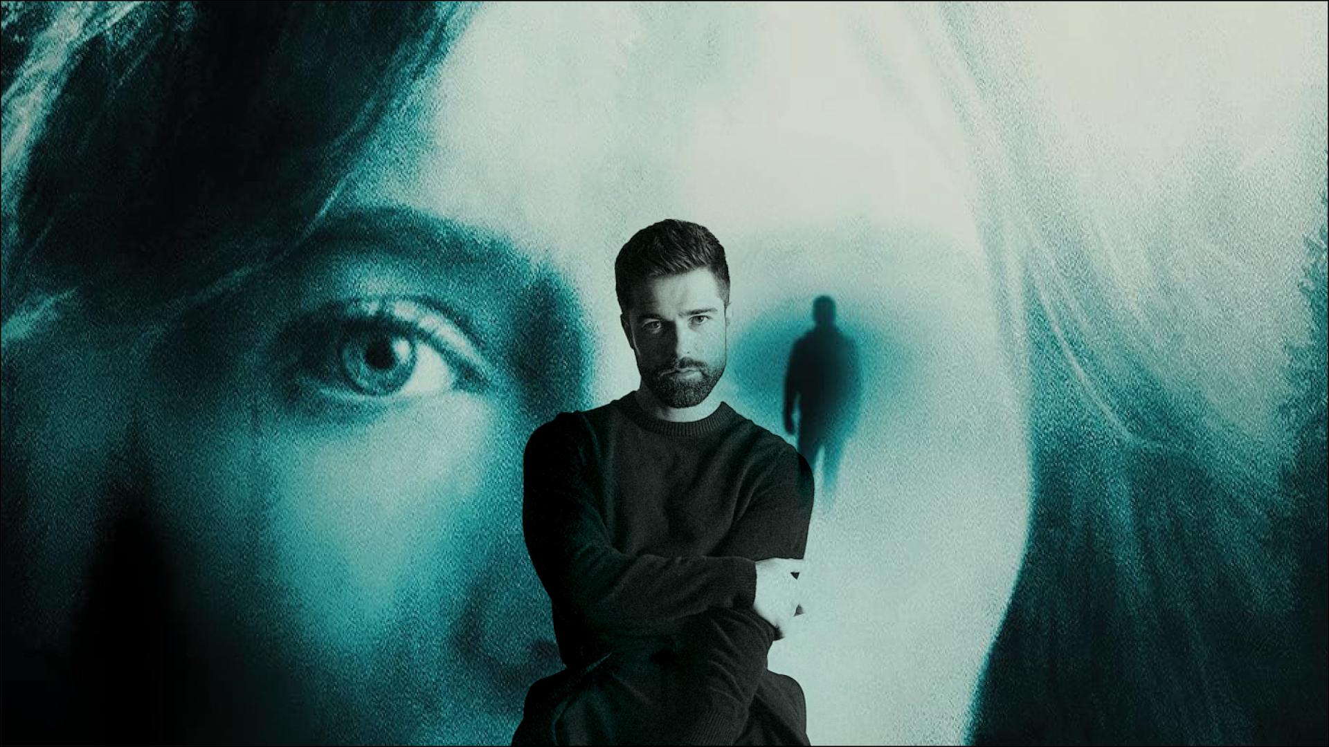 Studio 58 alum, Markian Tarasiuk, in the foreground with the poster of his movie in the background.