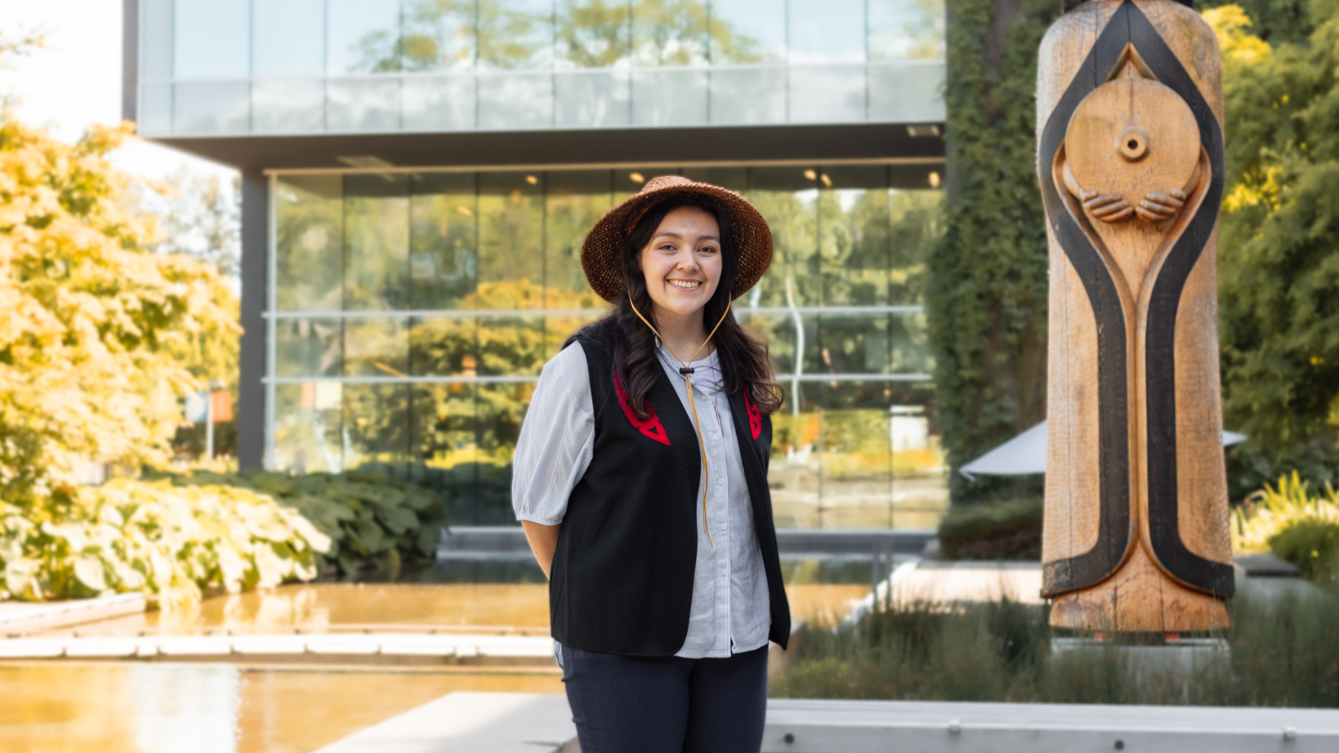 Langara alum, Amber Cornick, in front of the House Post and Library.