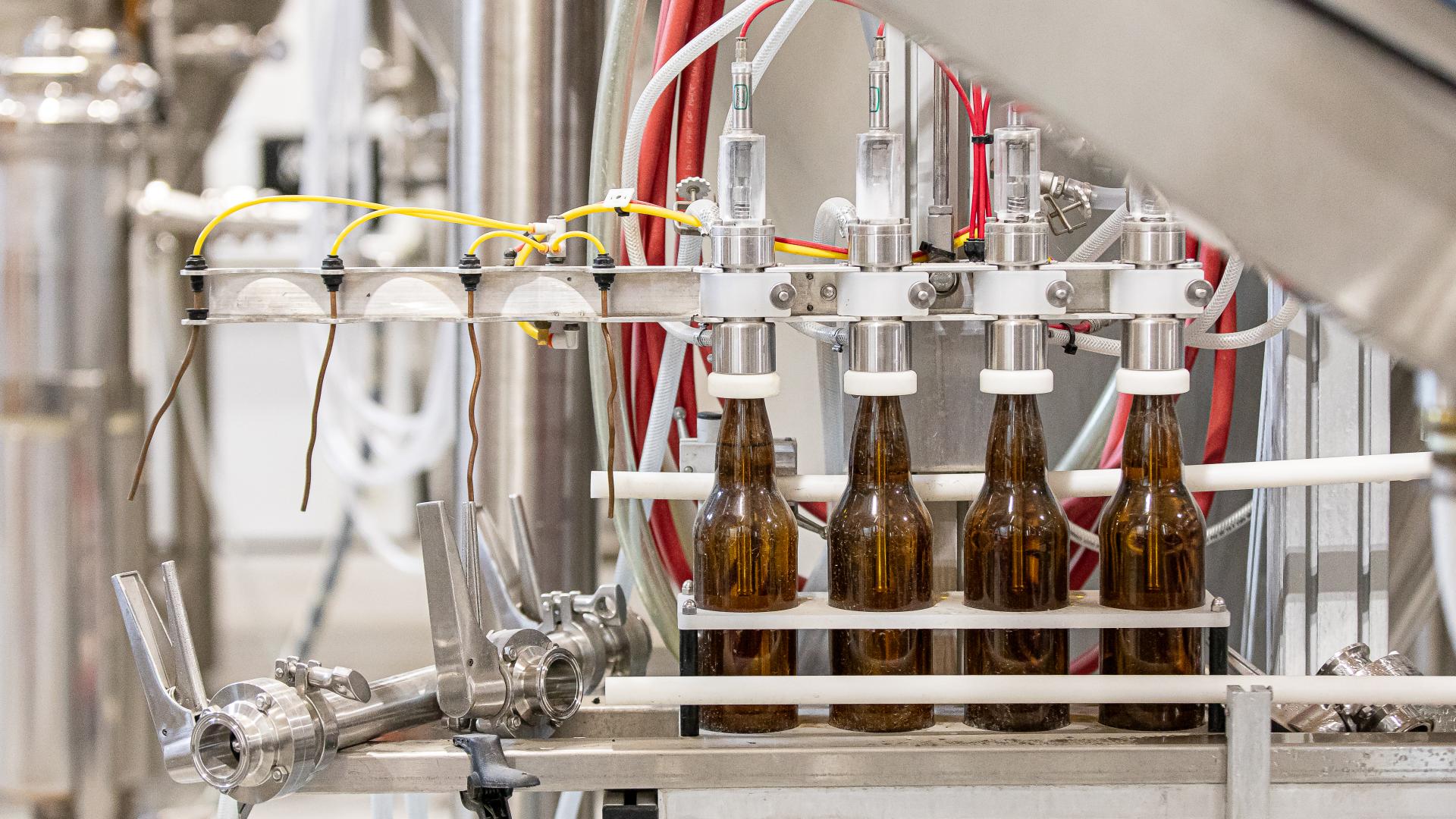 Brown beer bottles being filled on a production line at Barnside Brewing in Ladner, B.C.