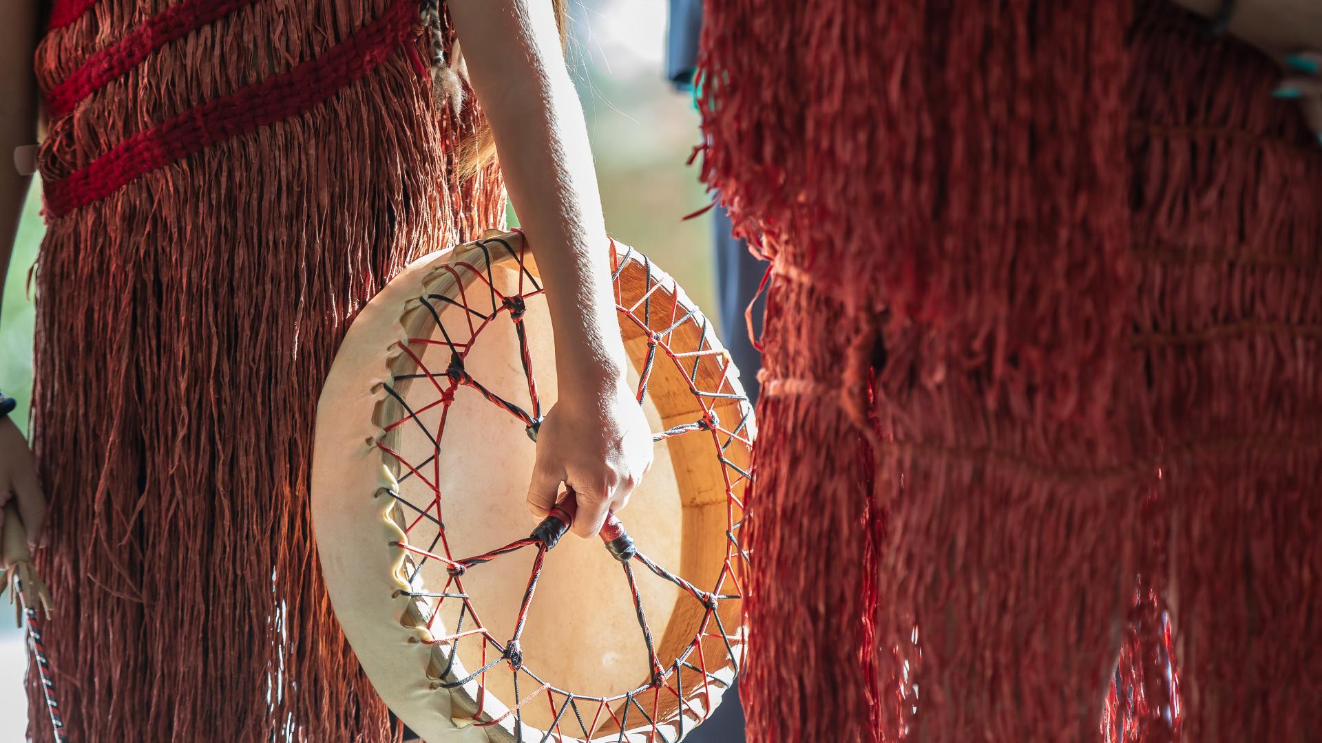 A traditional Musqueam drum being held by a member of Tsatsu Stalqayu (Coastal Wolfpack) during NDTR 2025.