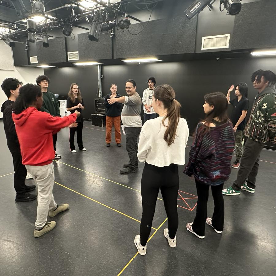 Raes Calvert teaches a group of students.