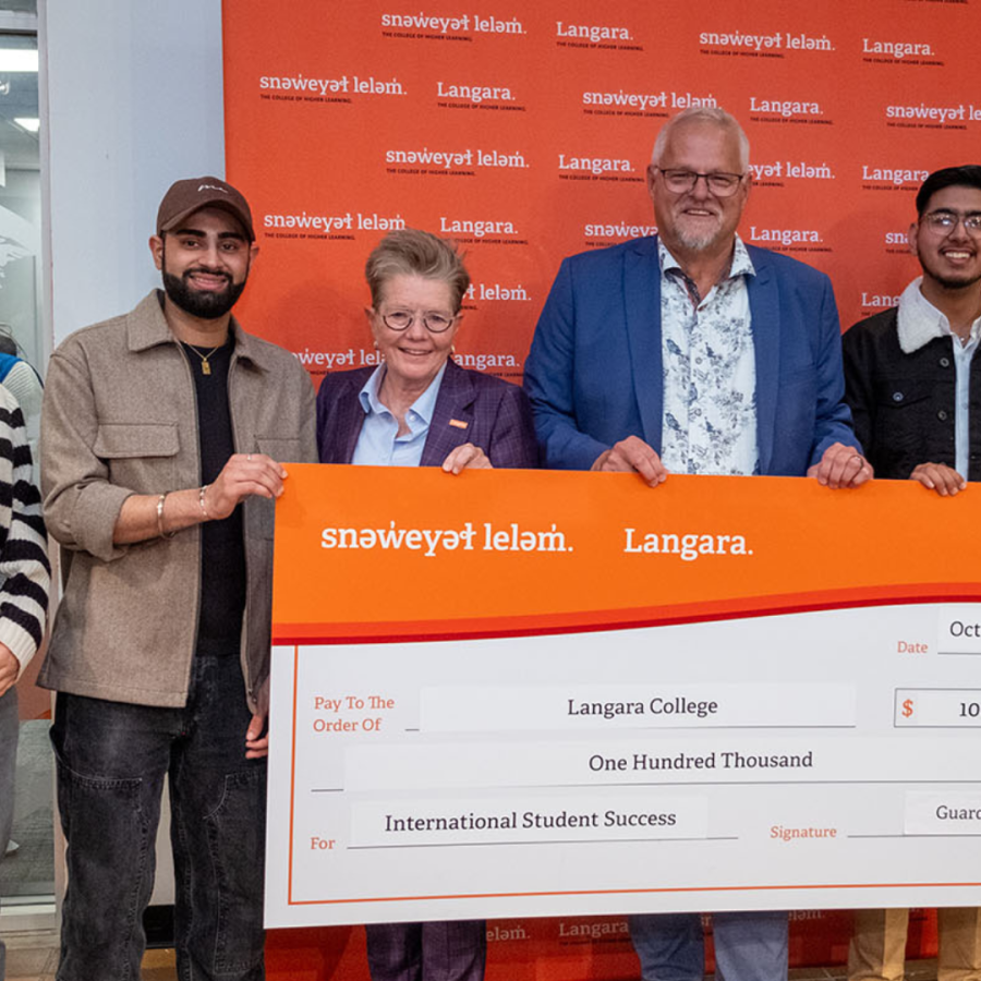 Students and Langara President receive a cheque from GuardMe