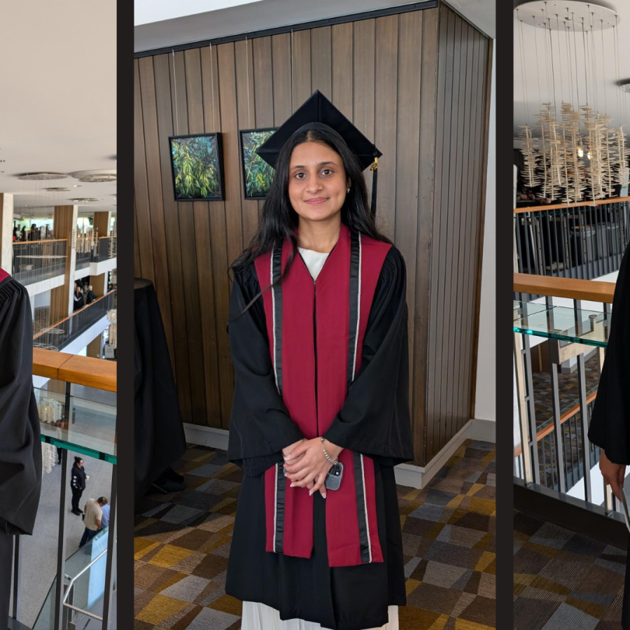 Graduates Khushi Salwan, Arshnoor Kaur, and Hnin (Elisa) Pwint wearing their convocation regalia at Queen Elizabeth Theatre.