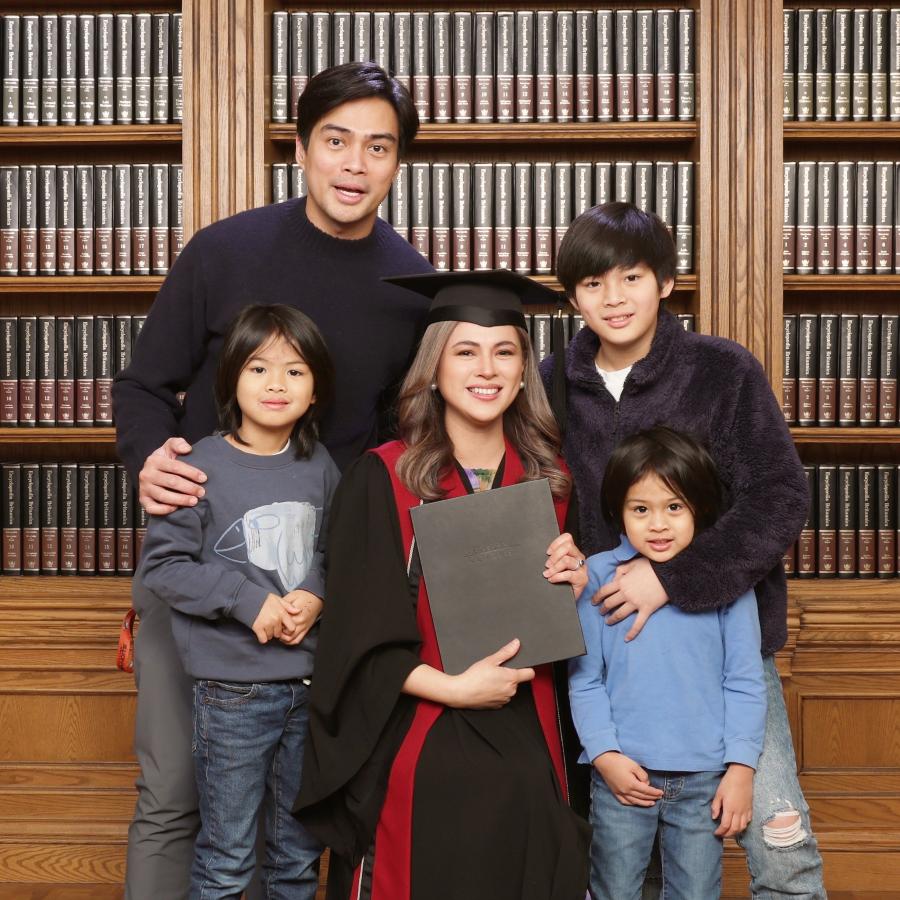 Langara ECE graduate Lara Quigaman with her family in a graduation portrait.