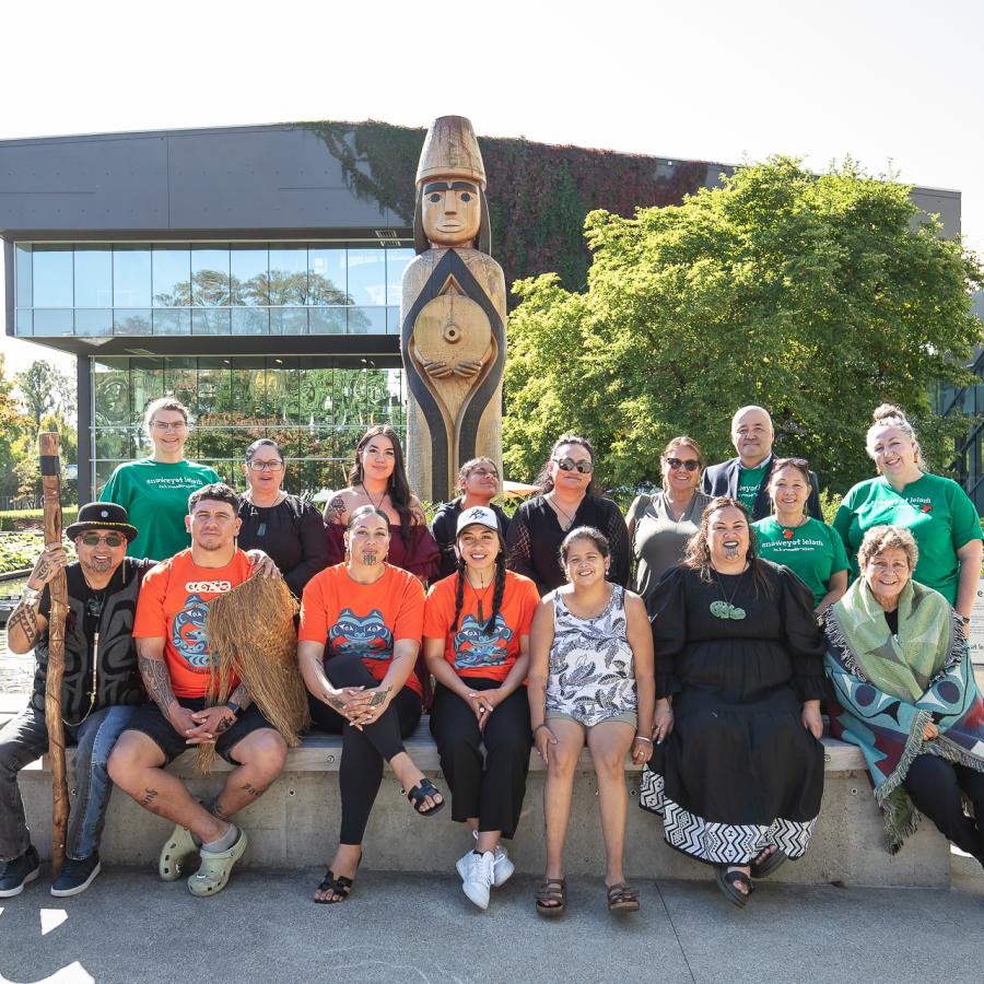 Members of Langara College's Indigenous Engagement and Initiatives team with Maori guests at the College's House Post, gifted by Musqueam.