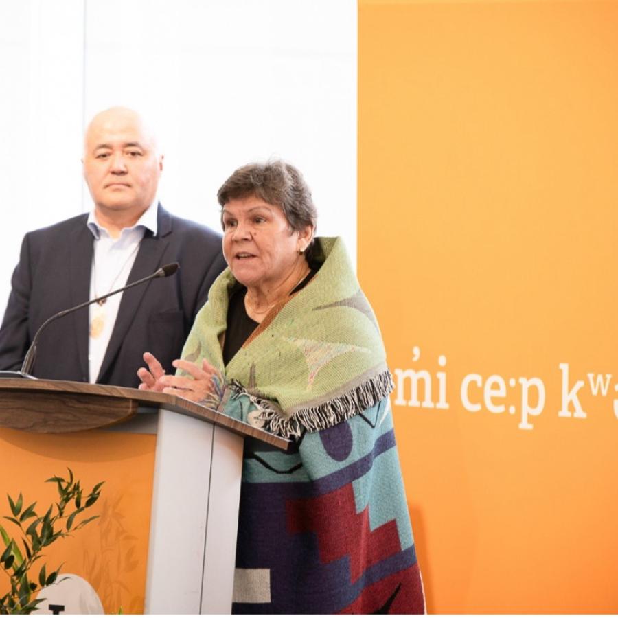 Musqueam Elder Gail Sparrow speaks to an audience.