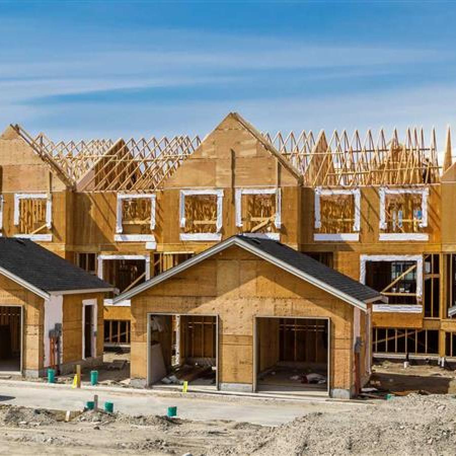 Housing developments in mid-build. Wooden framework is visible.