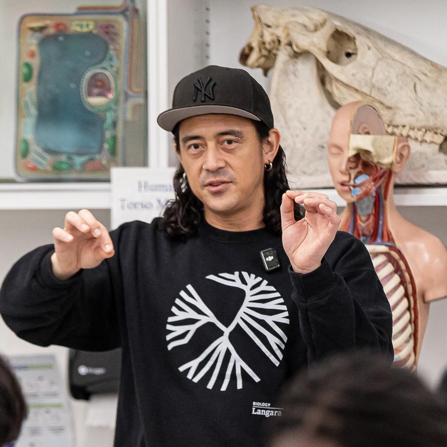 Biology lab demonstrator, Geoffrey Nemeth, reviews the day's work with students in T441.