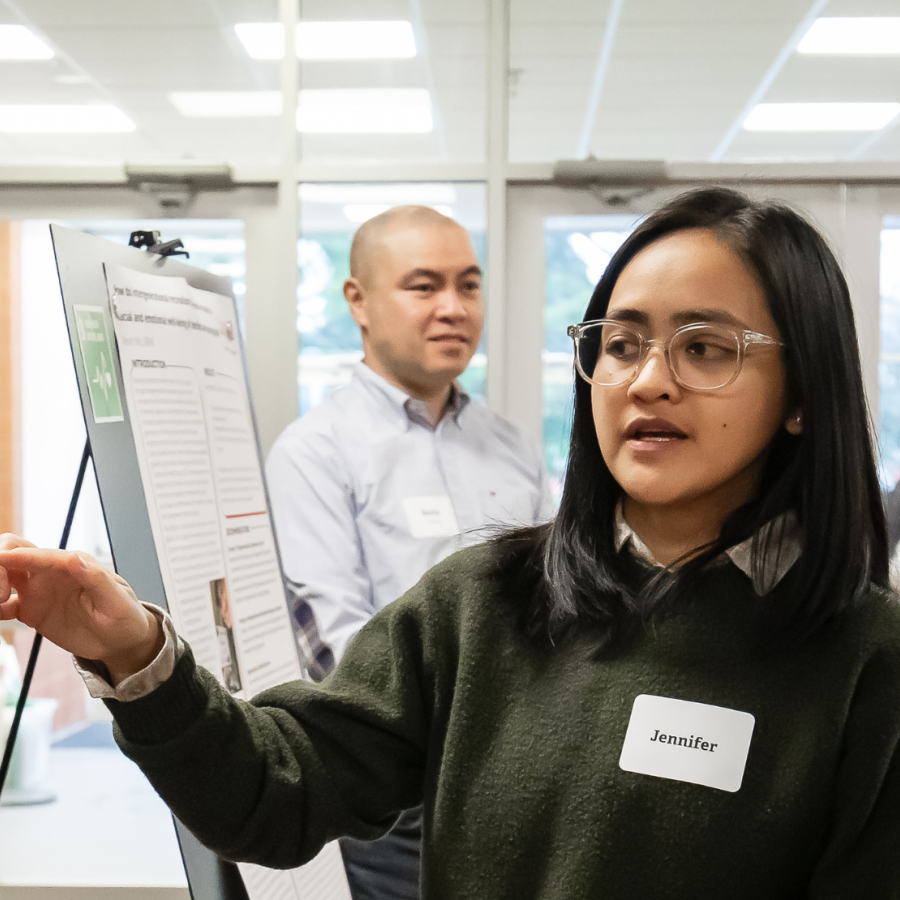 Junior Research Assistant, Jennifer Mallari, explains the IDEAs project at Applied Research Day, March 2026.