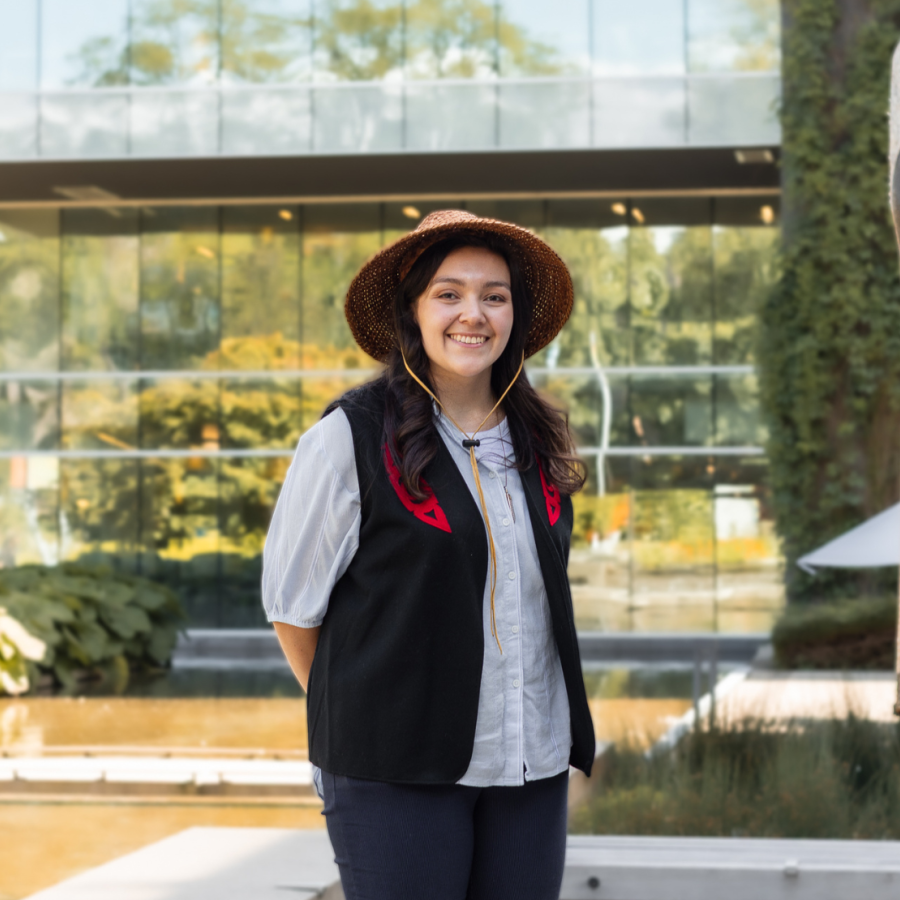 Langara alum, Amber Cornick, in front of the House Post and Library.