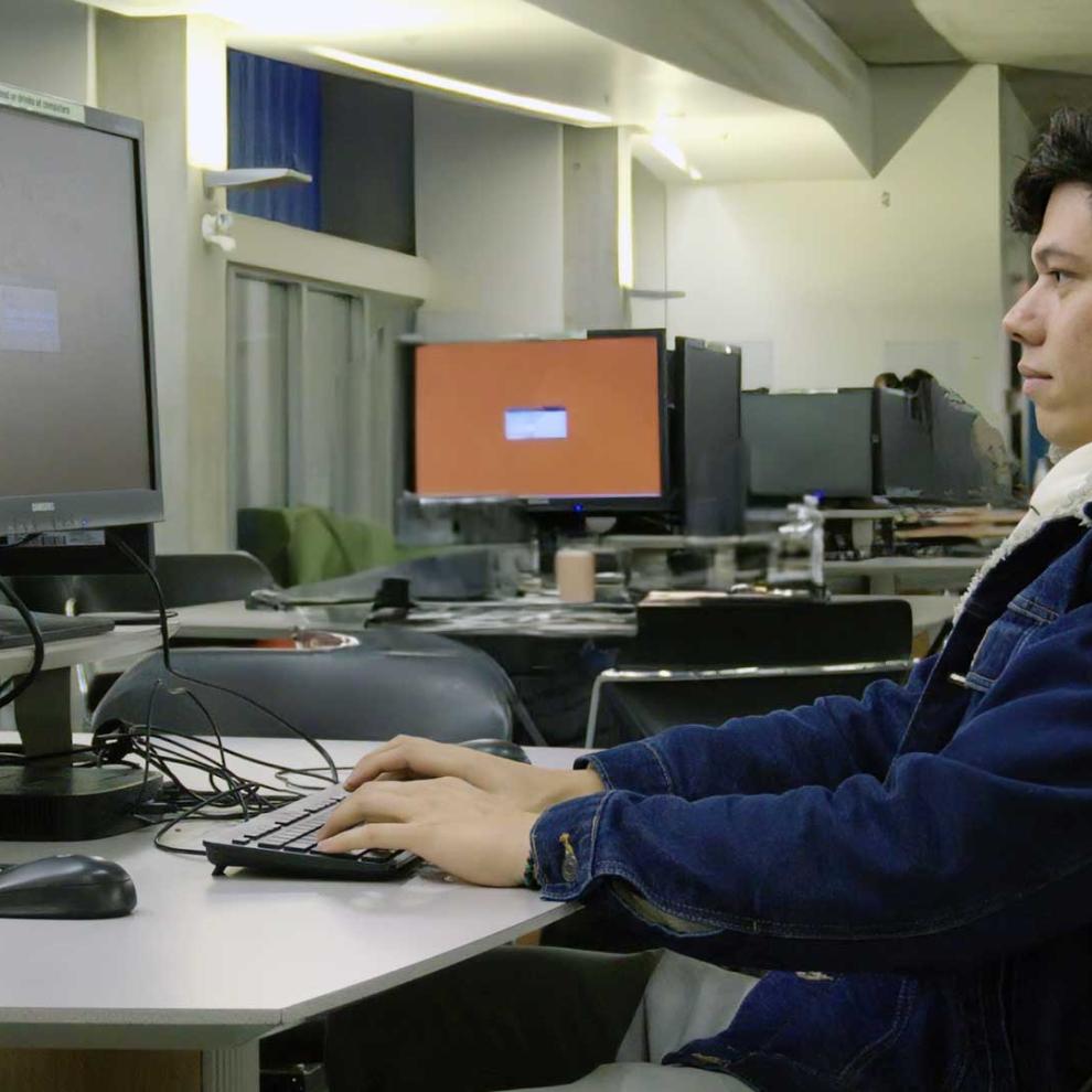 Andres Viloria Garcia at the library doing some homework