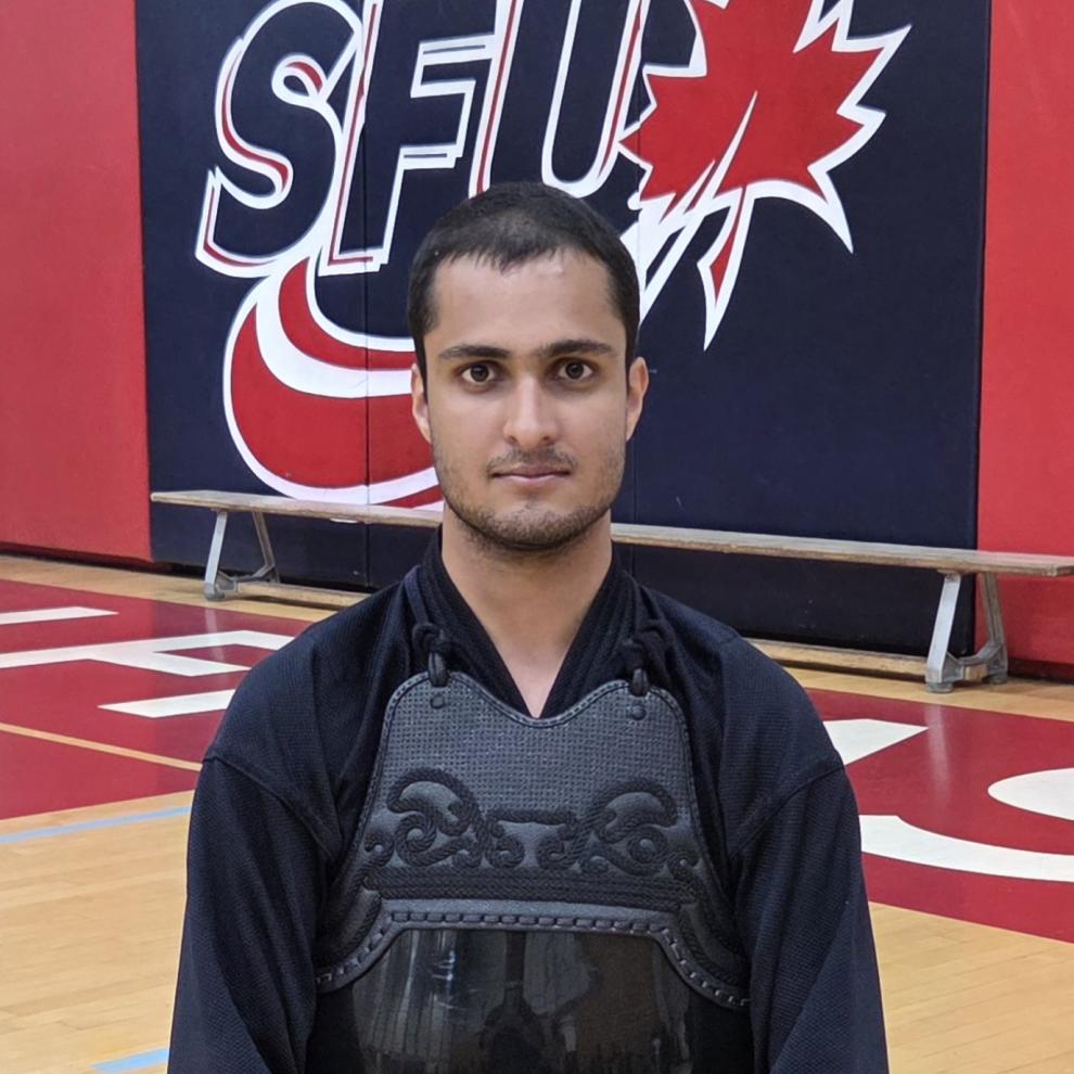 Criminology program alumnus Harmun Nagra pictured in the SFU gymnasium.