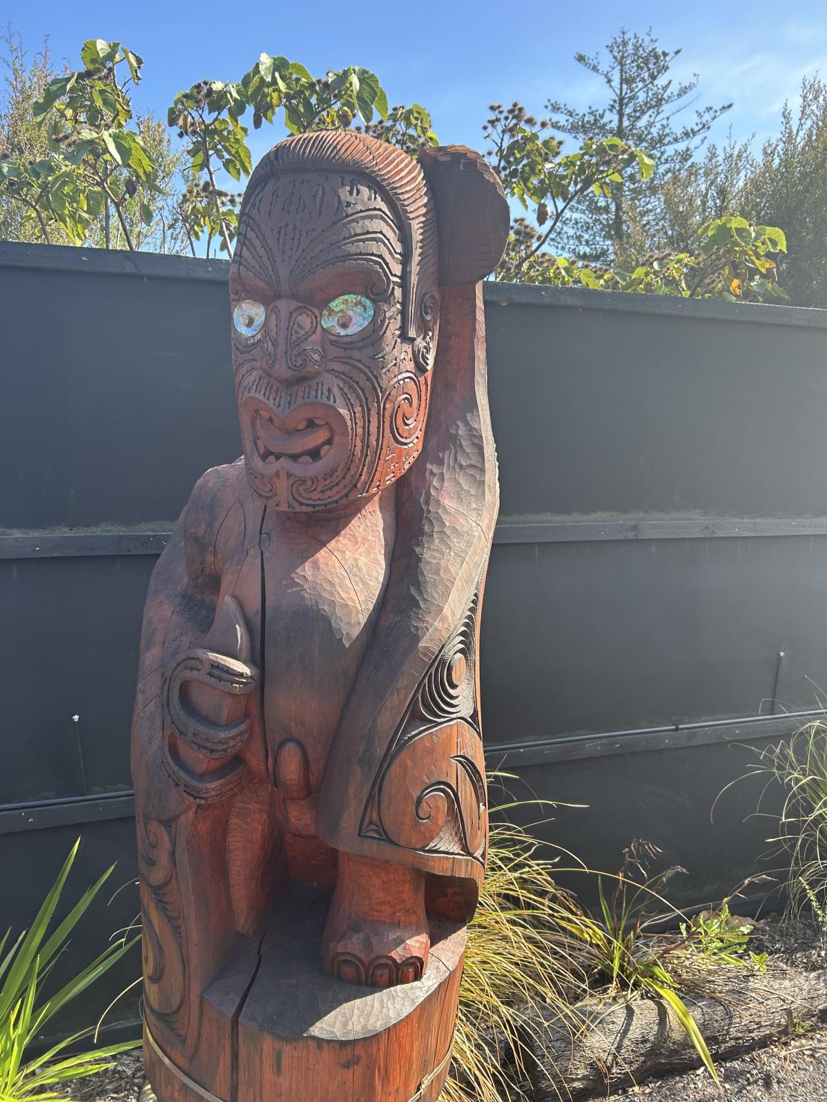A carved Māori statue.