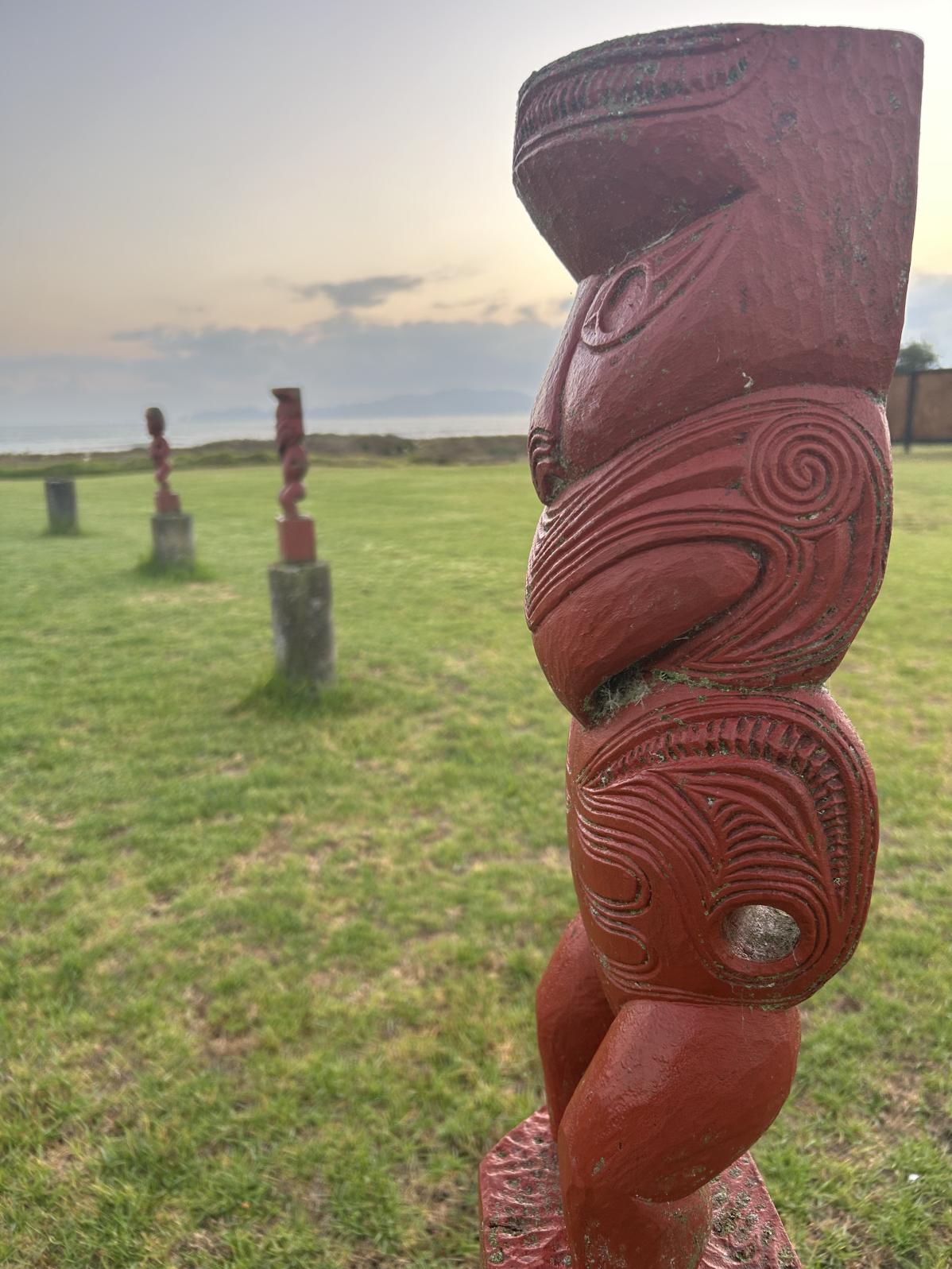 A carved Māori statue.