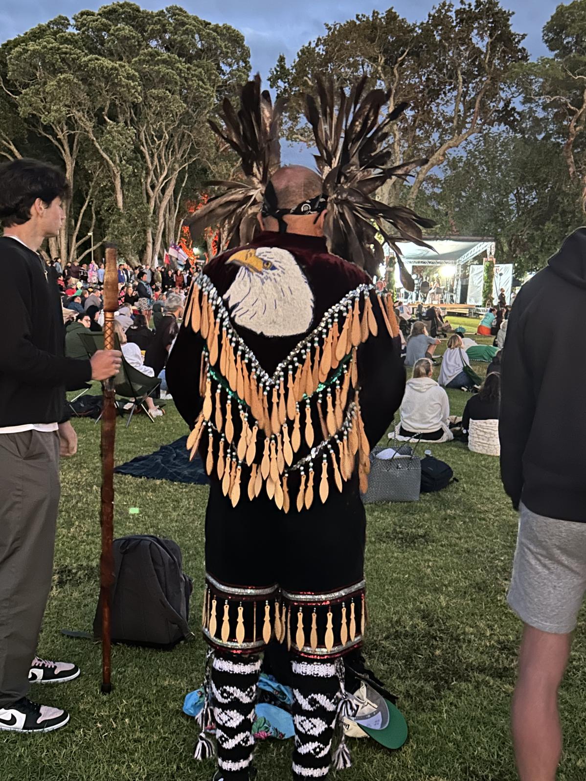 A Māori community member in traditional dress.