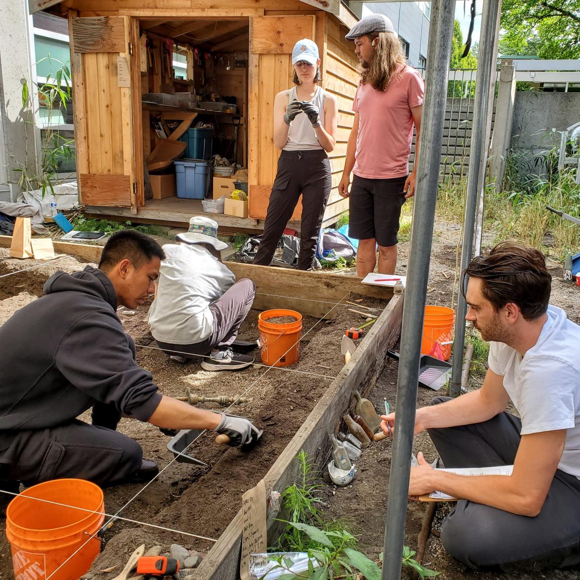 Archaeology students digging on site