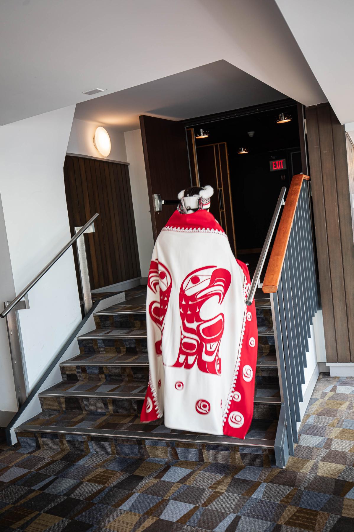 An Indigenous design stitched into traditional attire worn by a graduating student.