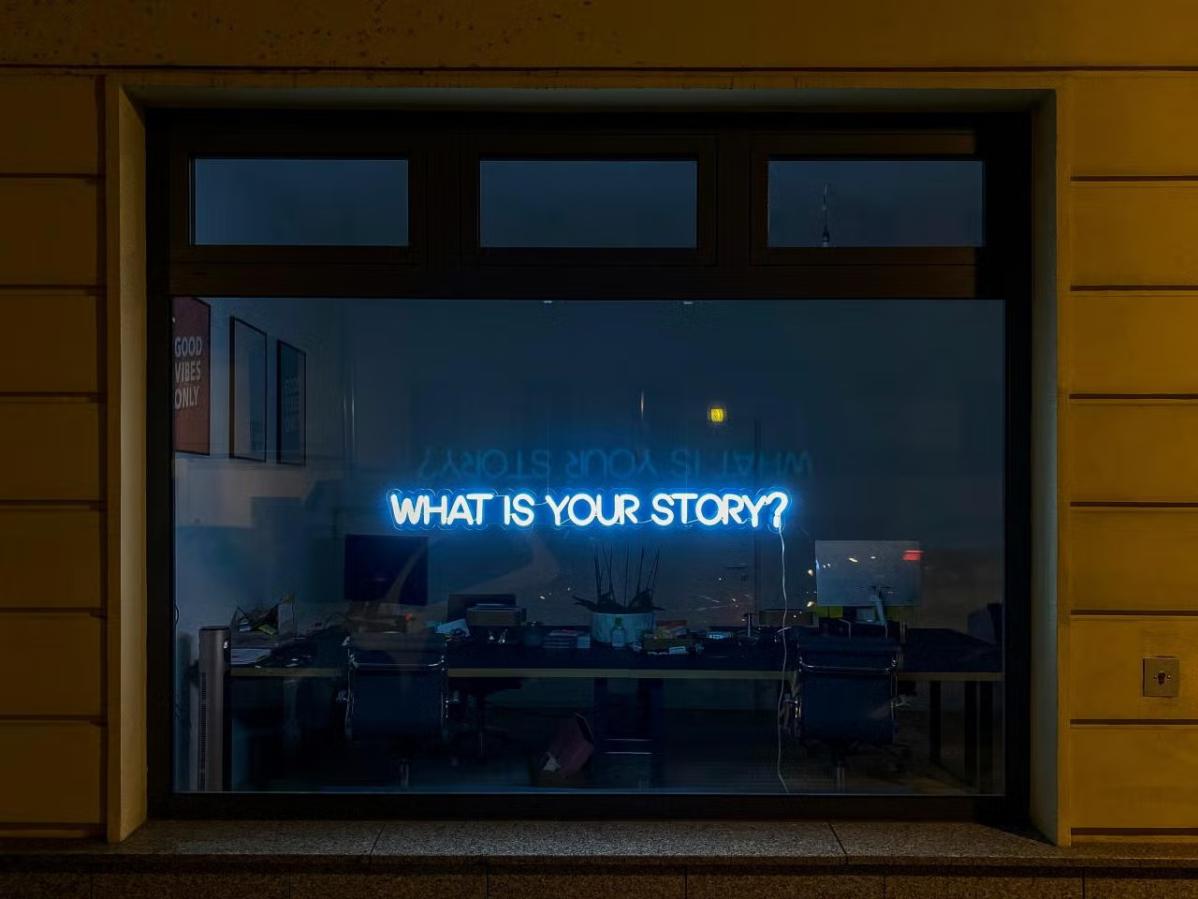 Window with text reading "what is your story?'