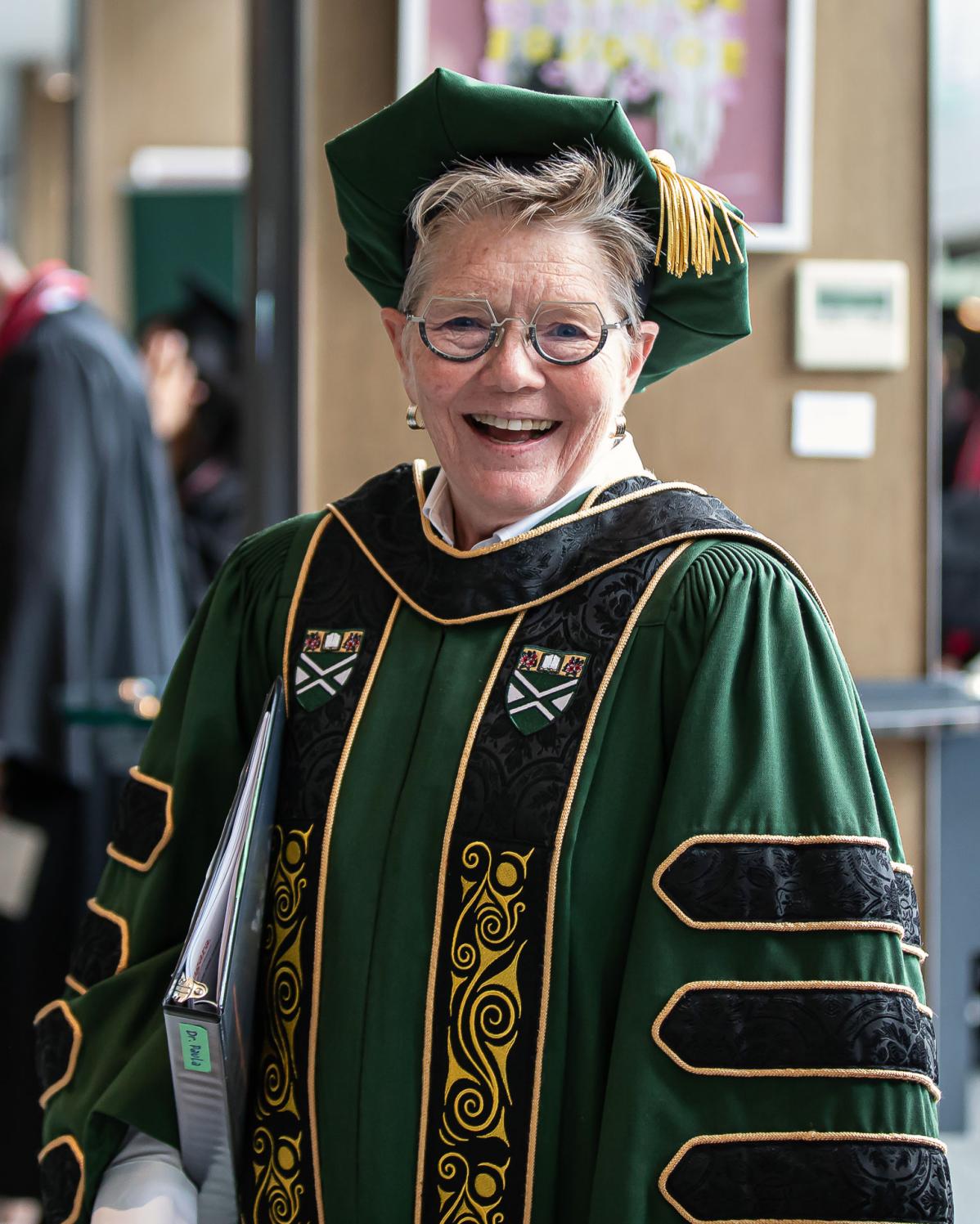 Dr. Paula Burns wearing the President’s regalia featuring Indigenous design elements that honour Indigenous cultures and traditions
