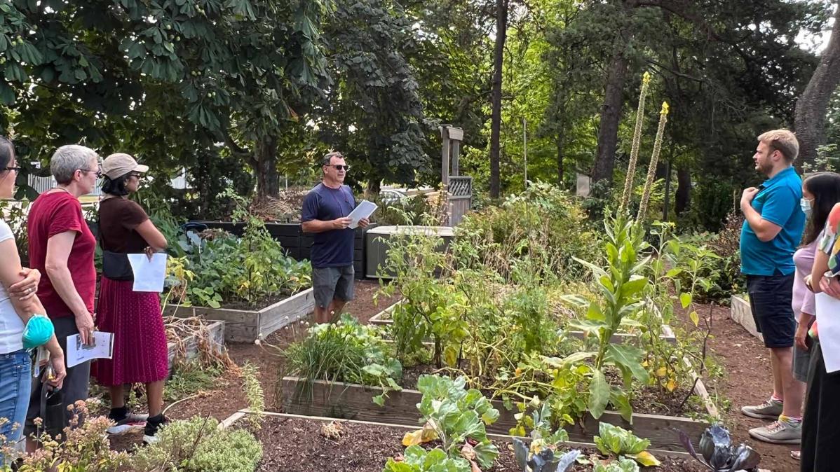 Students learning in the community garden.
