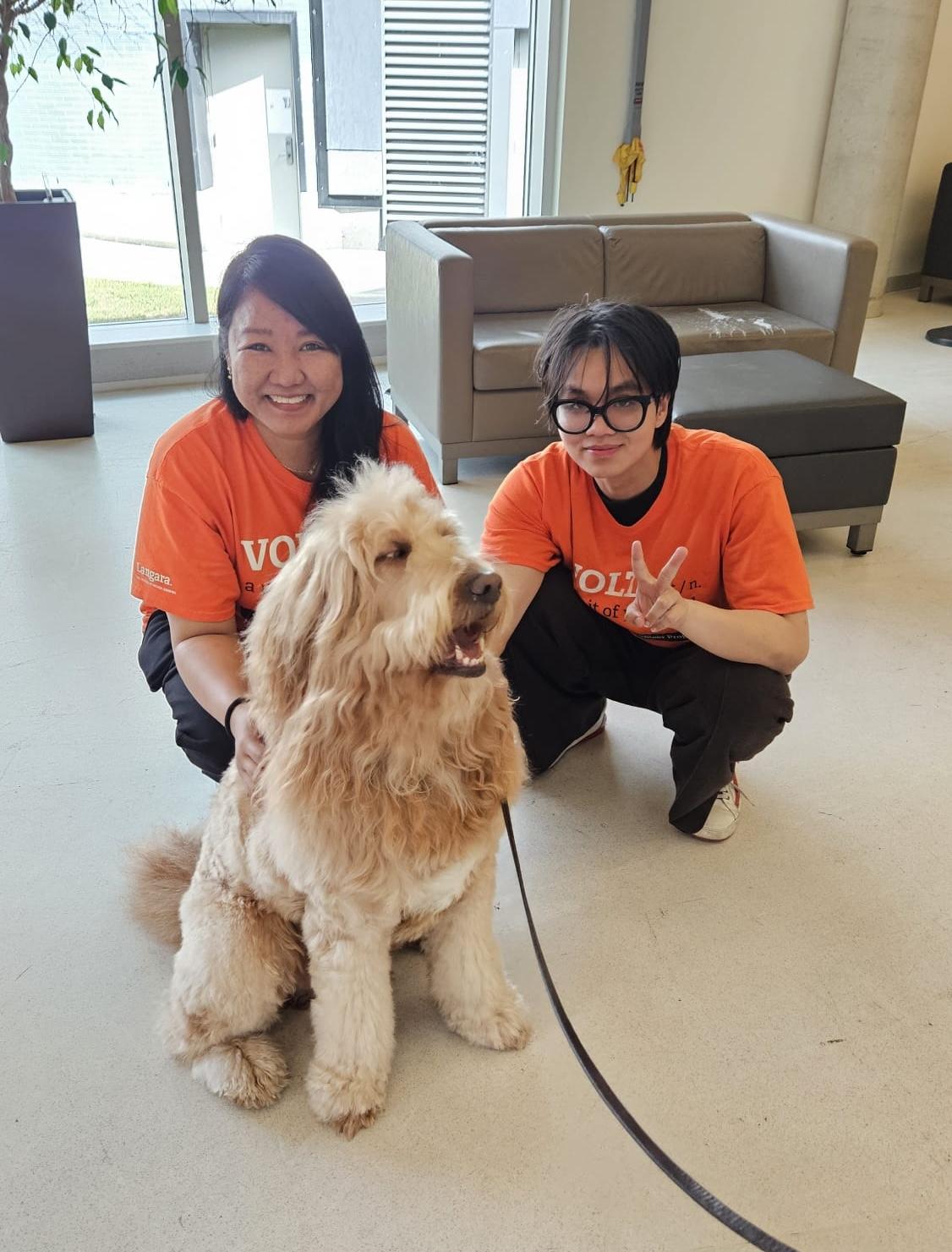 VOLT student Semie Graces Francisco at Pet Therapy event in summer 2026.